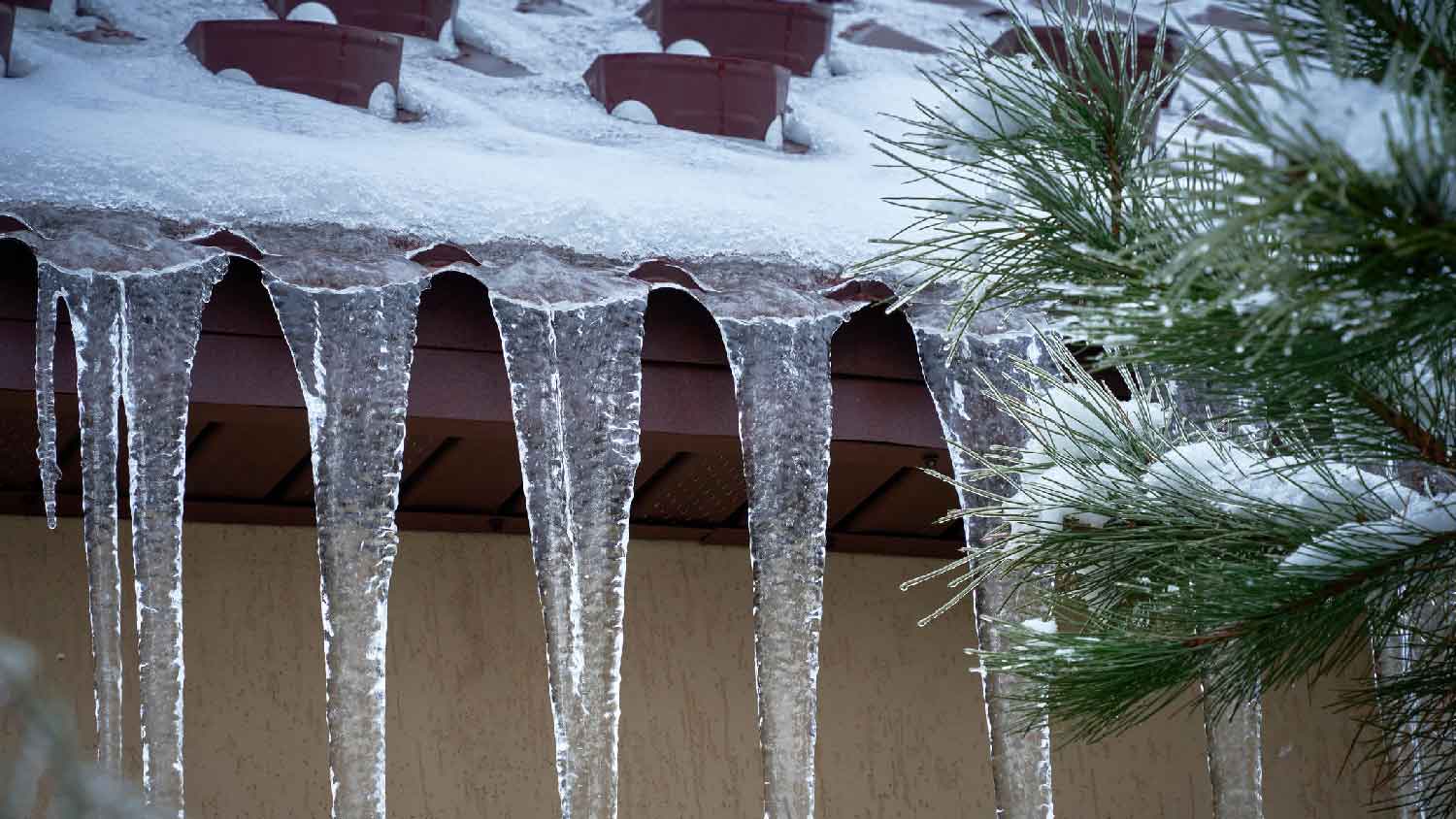 Close-up of formed ice dams on a roof