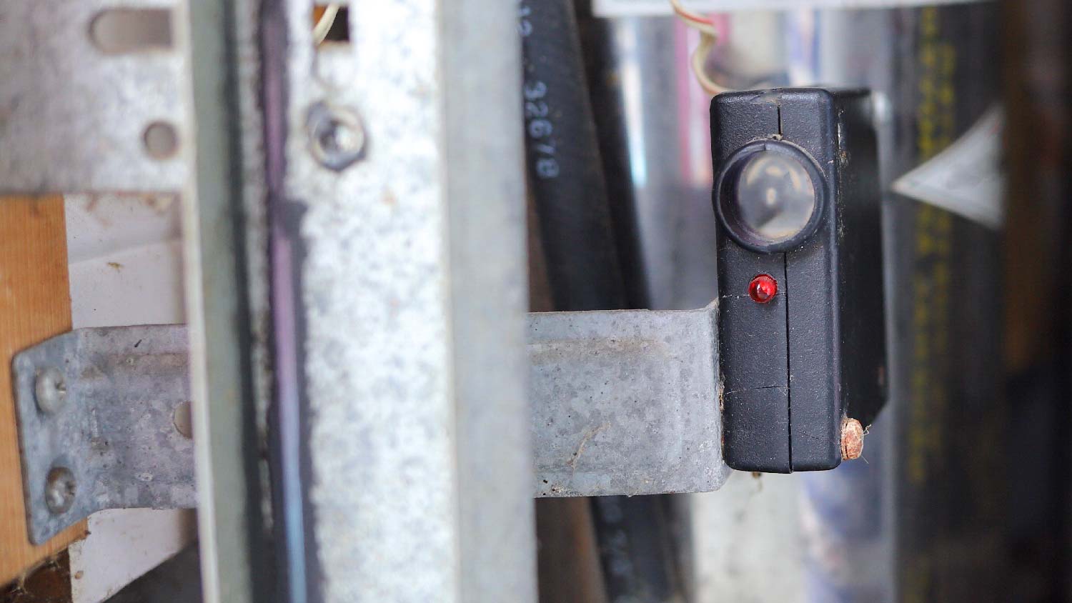 Close-up of a garage door sensor