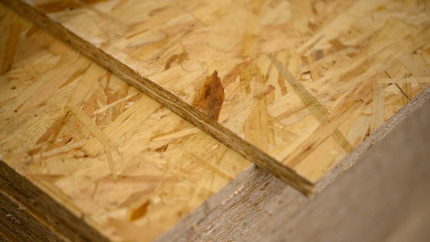 Close-up of stacked OSB sheets