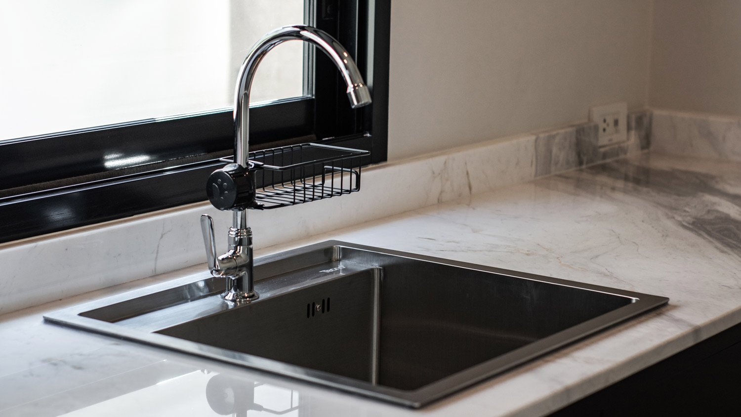 Close-up of a quartz countertop and a kitchen sink