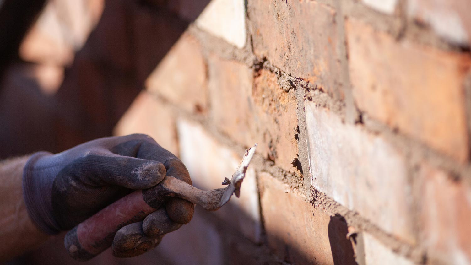 Close-up of repairing a brick wall