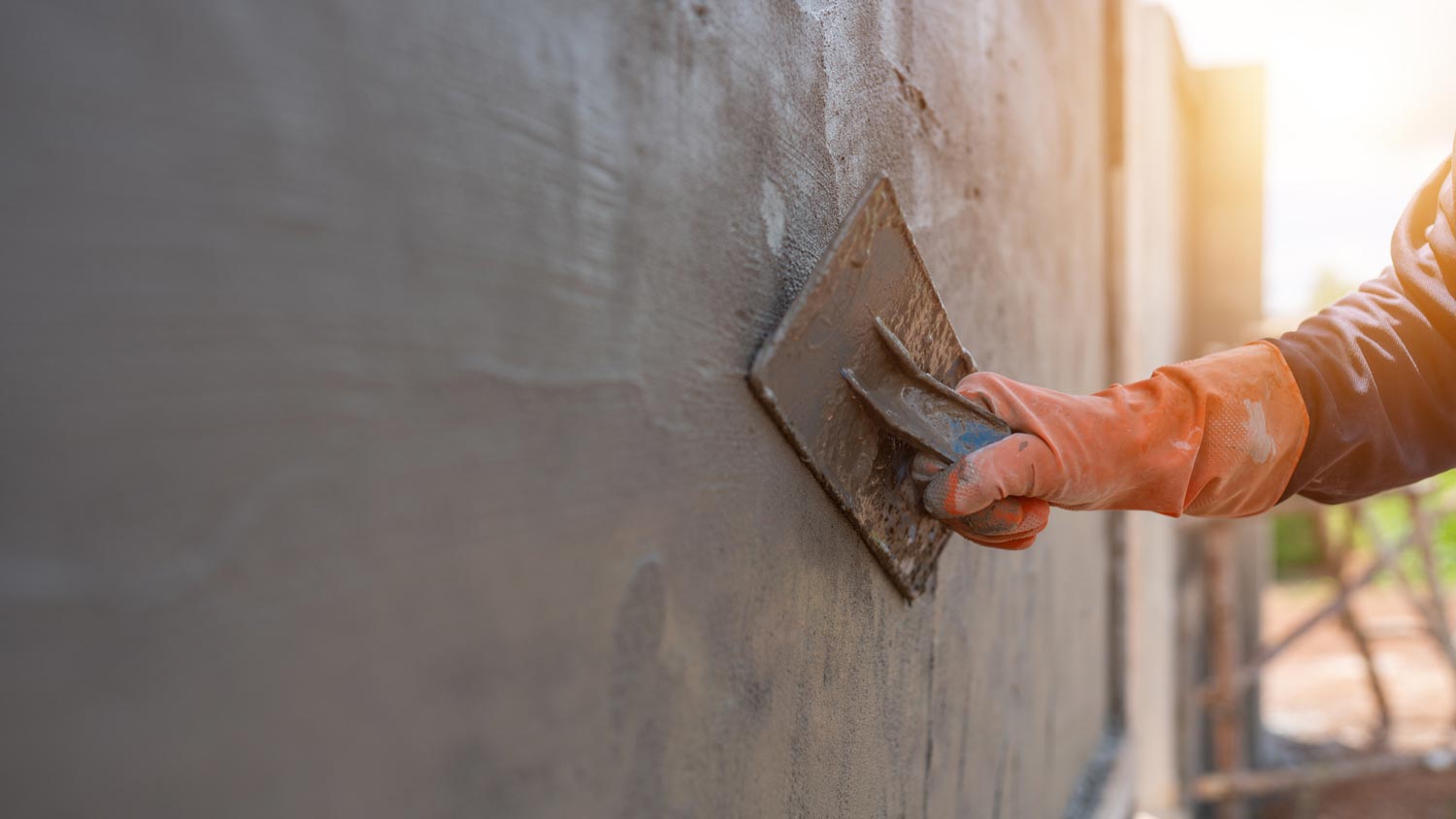 Close-up of a person sealing a foundation