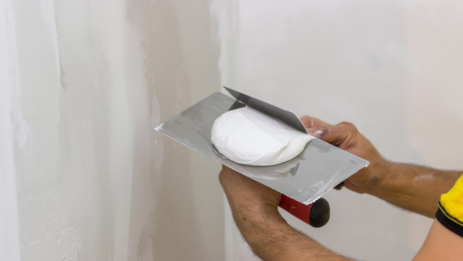 Close-up of spackle on a spatula