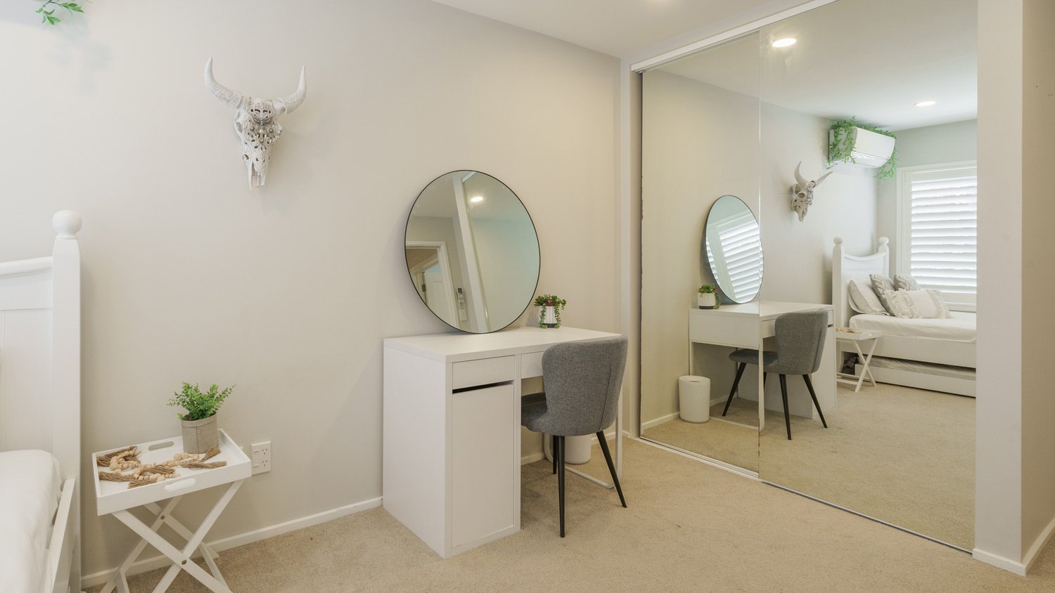 Bedroom with full mirror closet doors