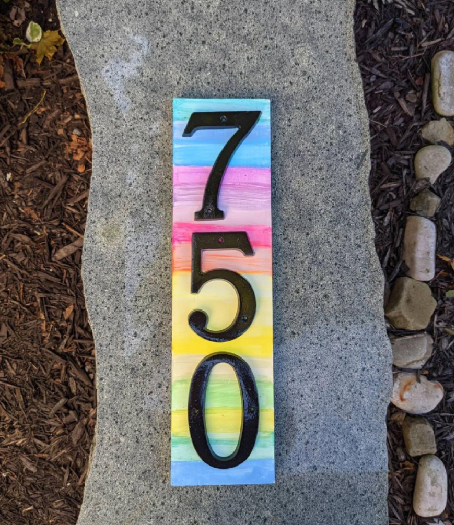 A colorful rainbow address rock