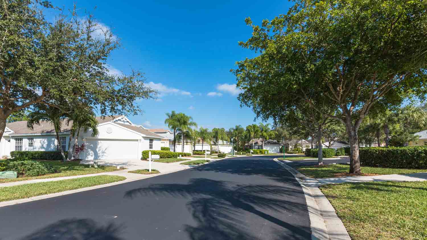 community home with asphalt road