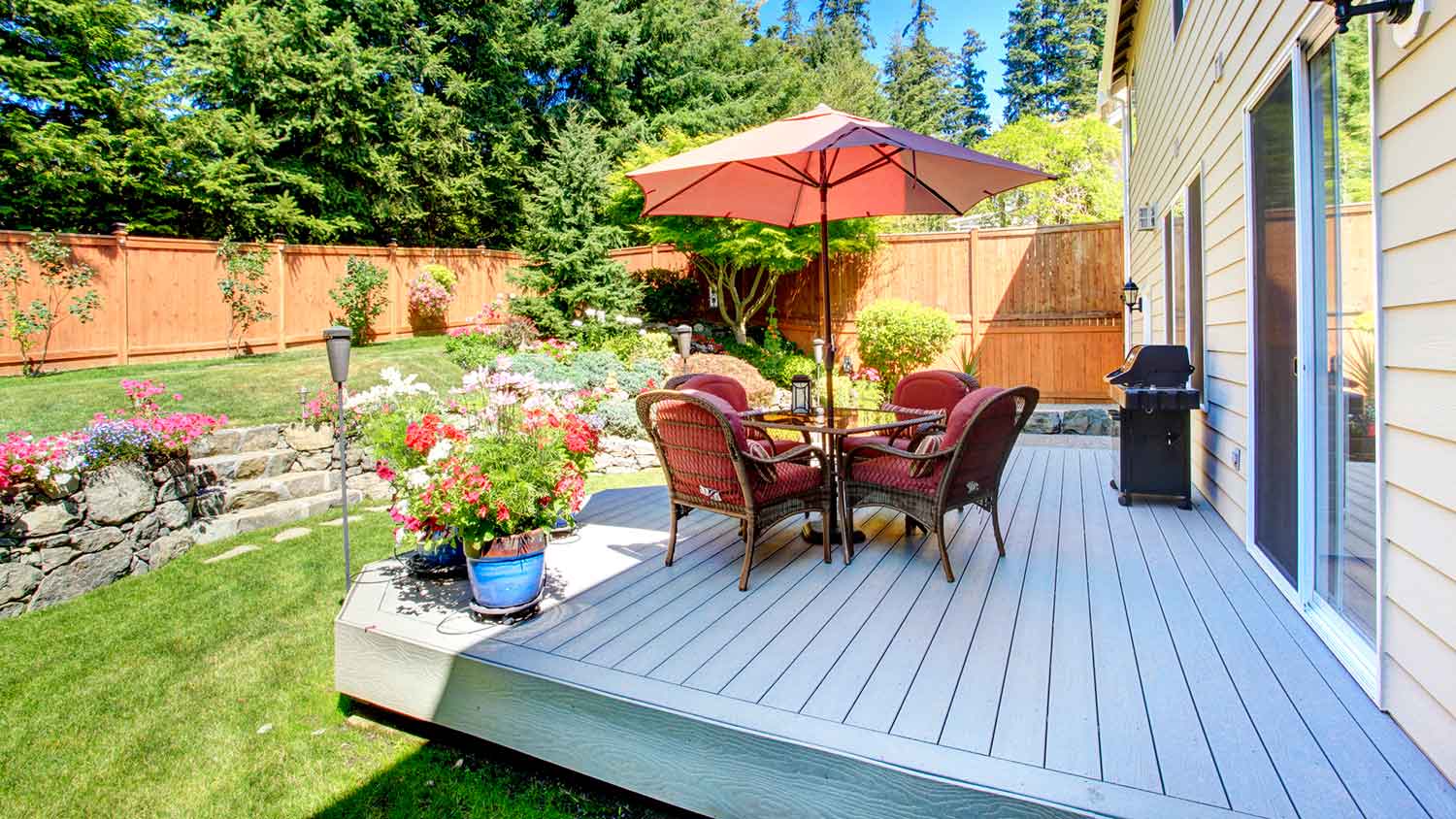 Attached composite deck installed in the backyard