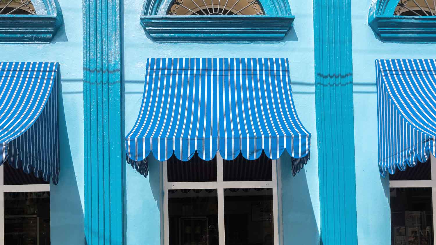 Concave awning installed above the window