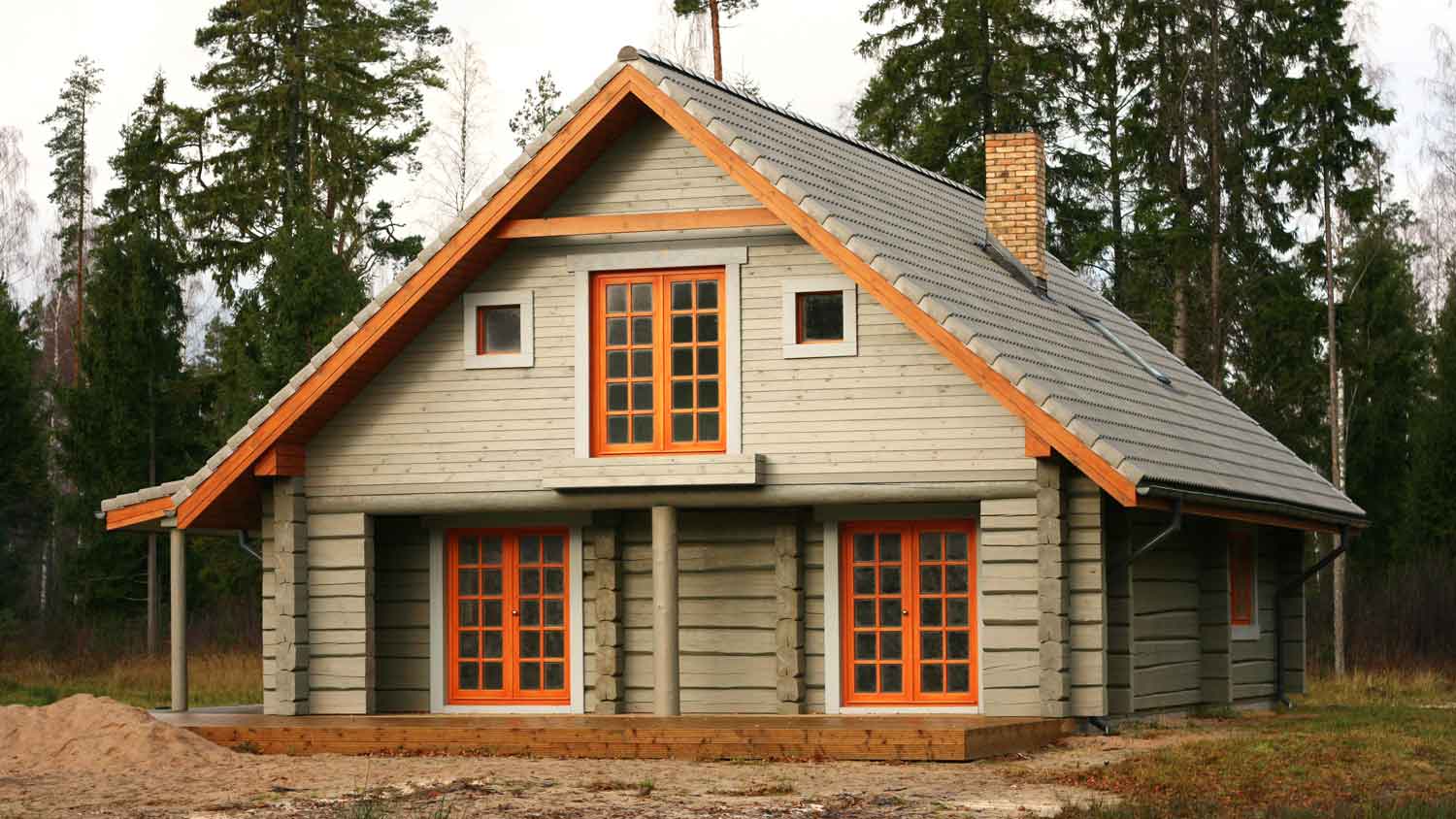 A concrete log lodge in the woods