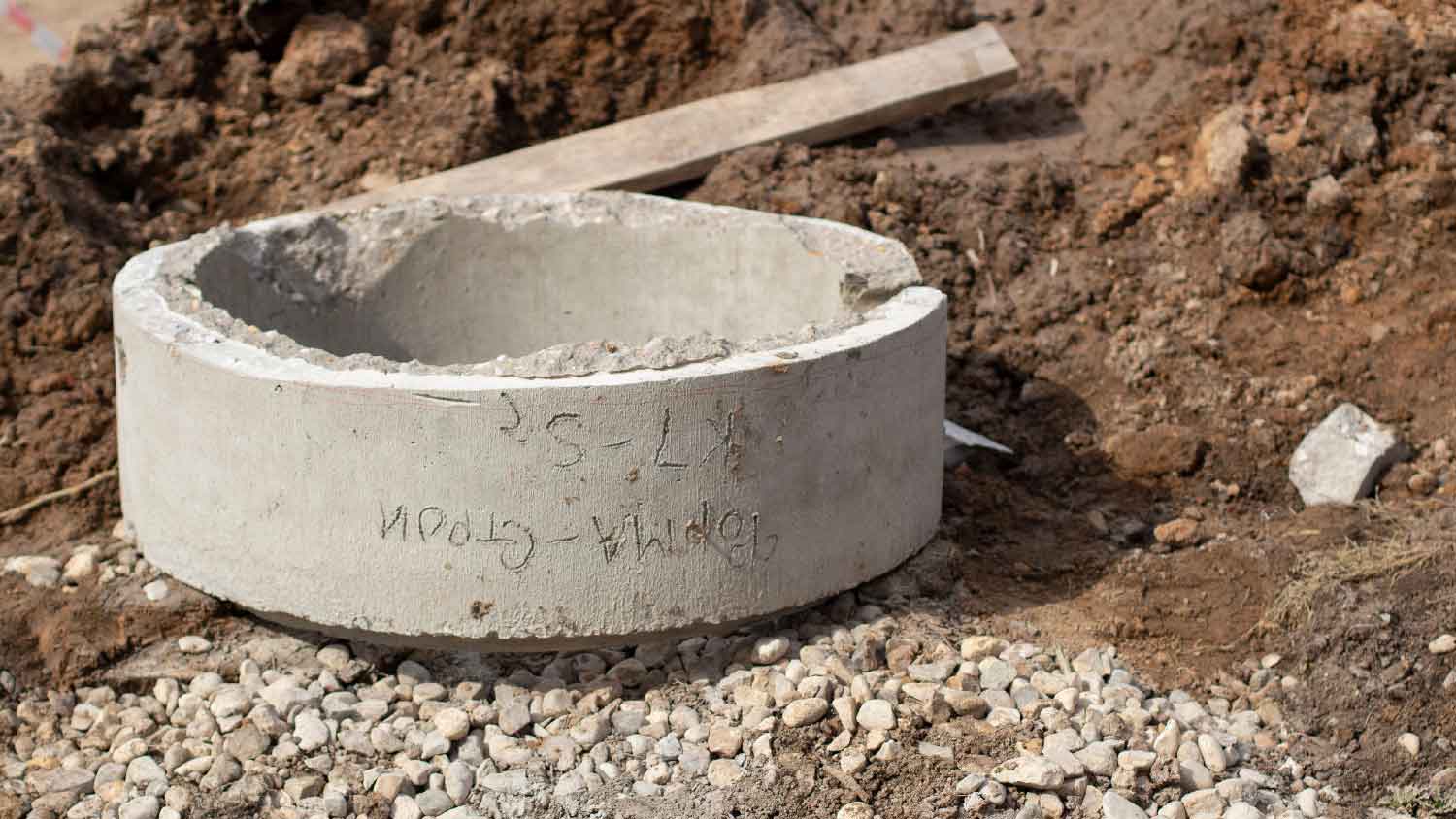 Concrete cylinder wall protecting the well