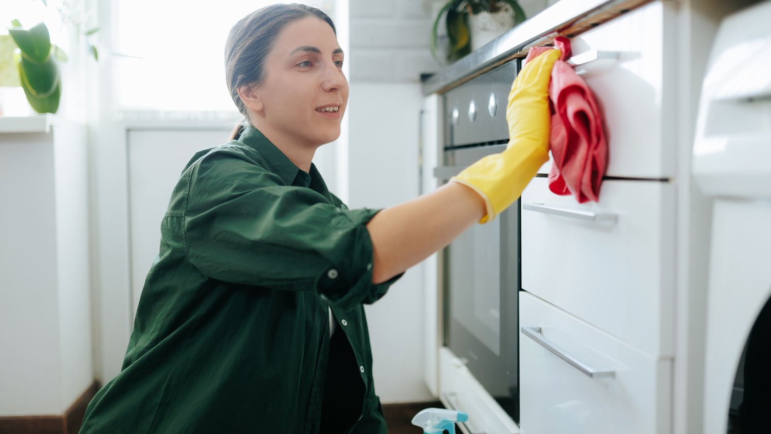 woman cleaning kitchen