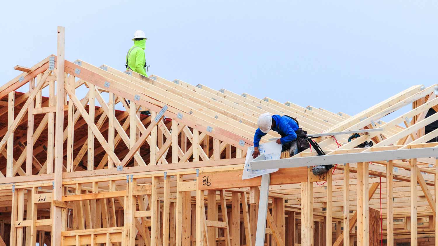 construction workers framing house 