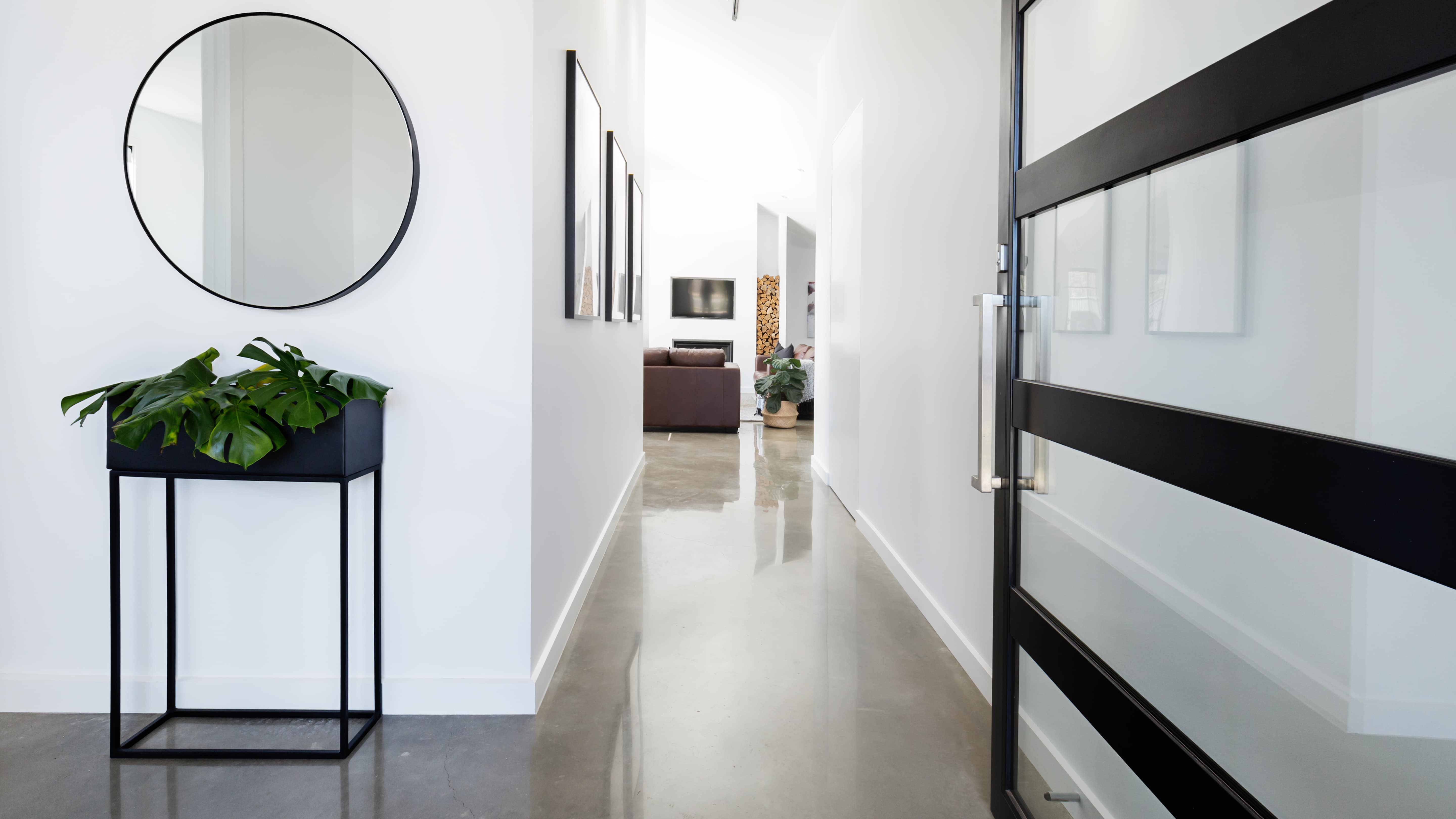 Contemporary home entryway with polished concrete floor