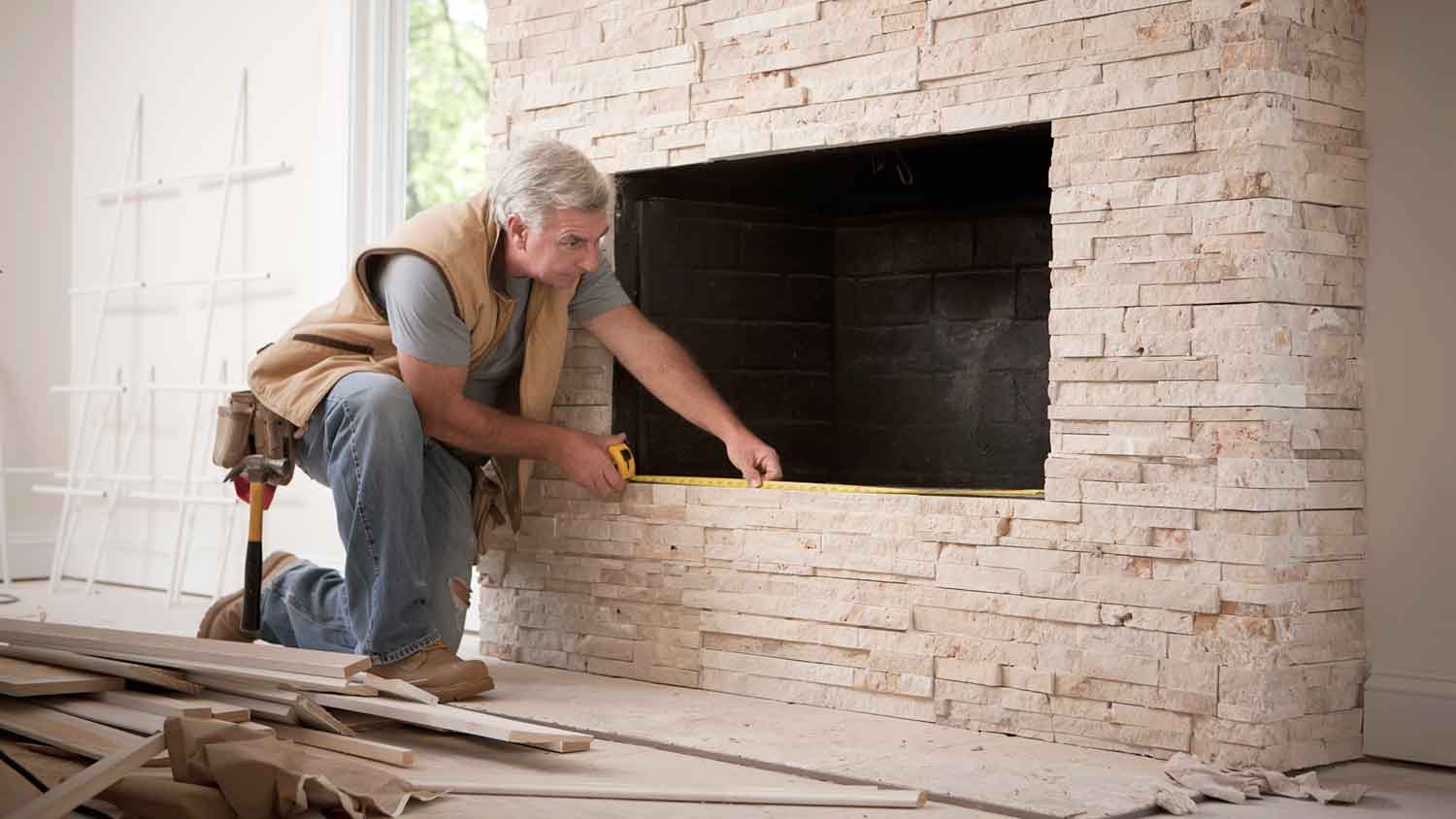 Contractor remodeling wood fireplace