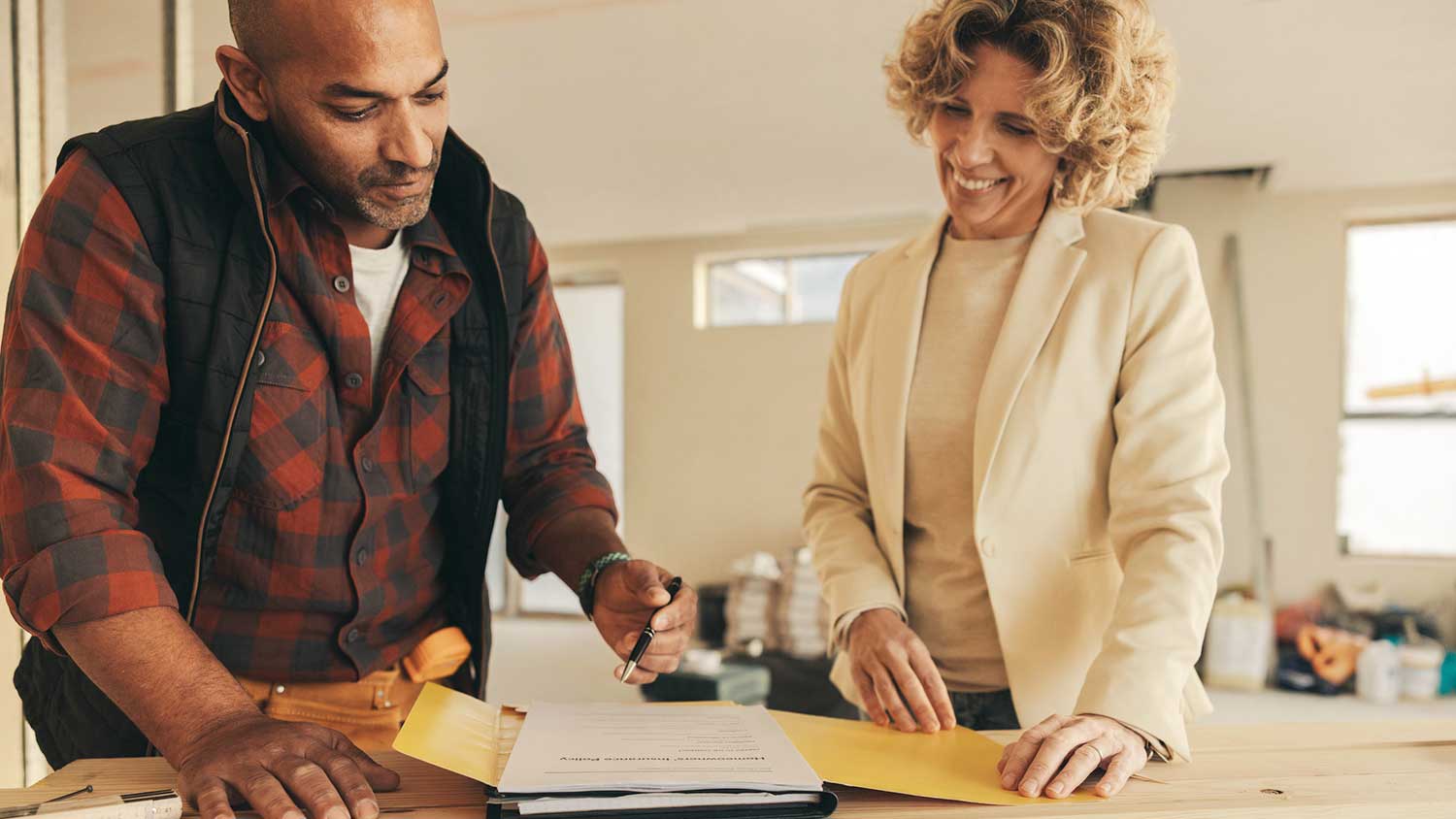 Contractor and client signing an agreement