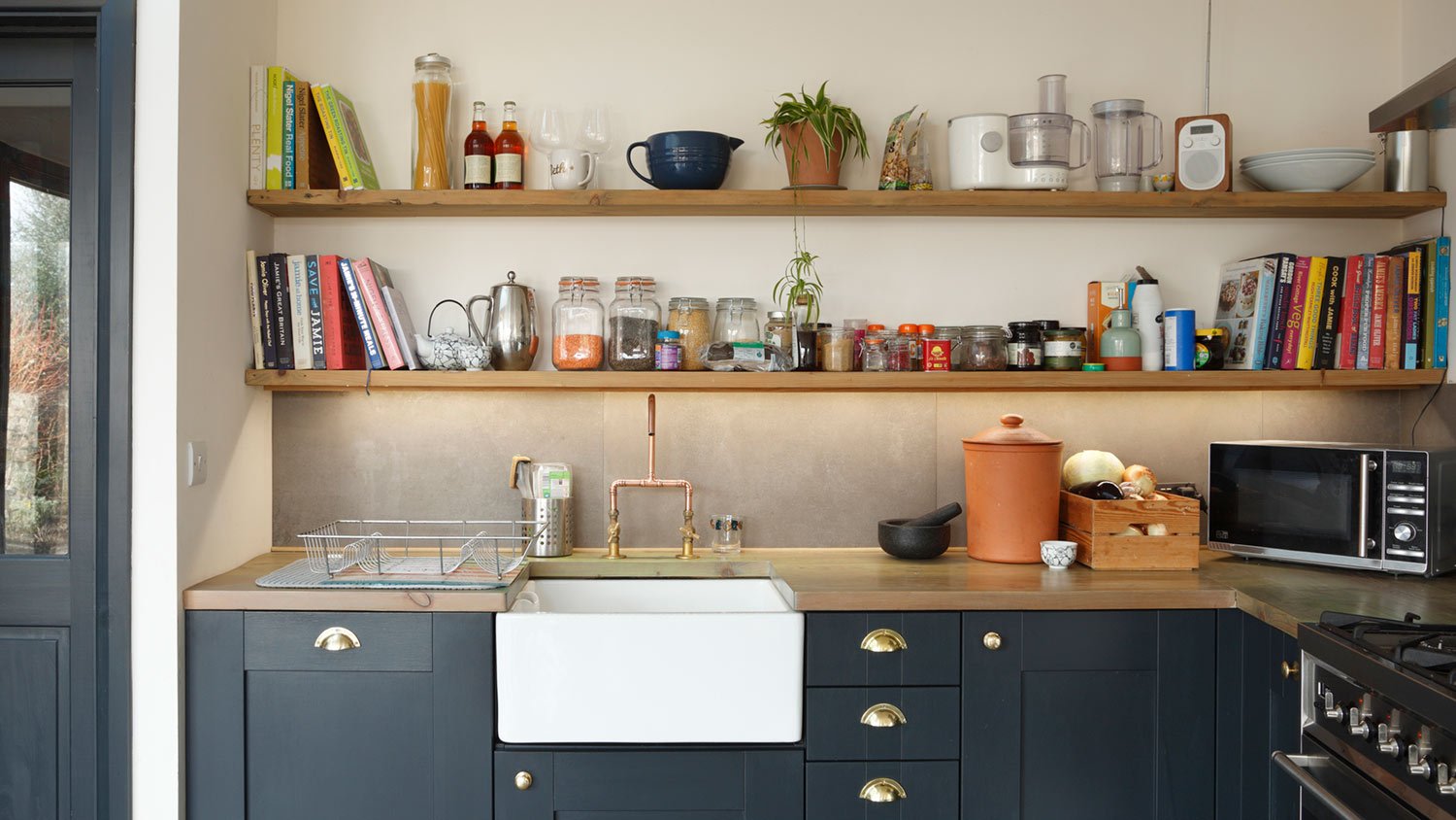 Cookbooks on shelf in kitchen