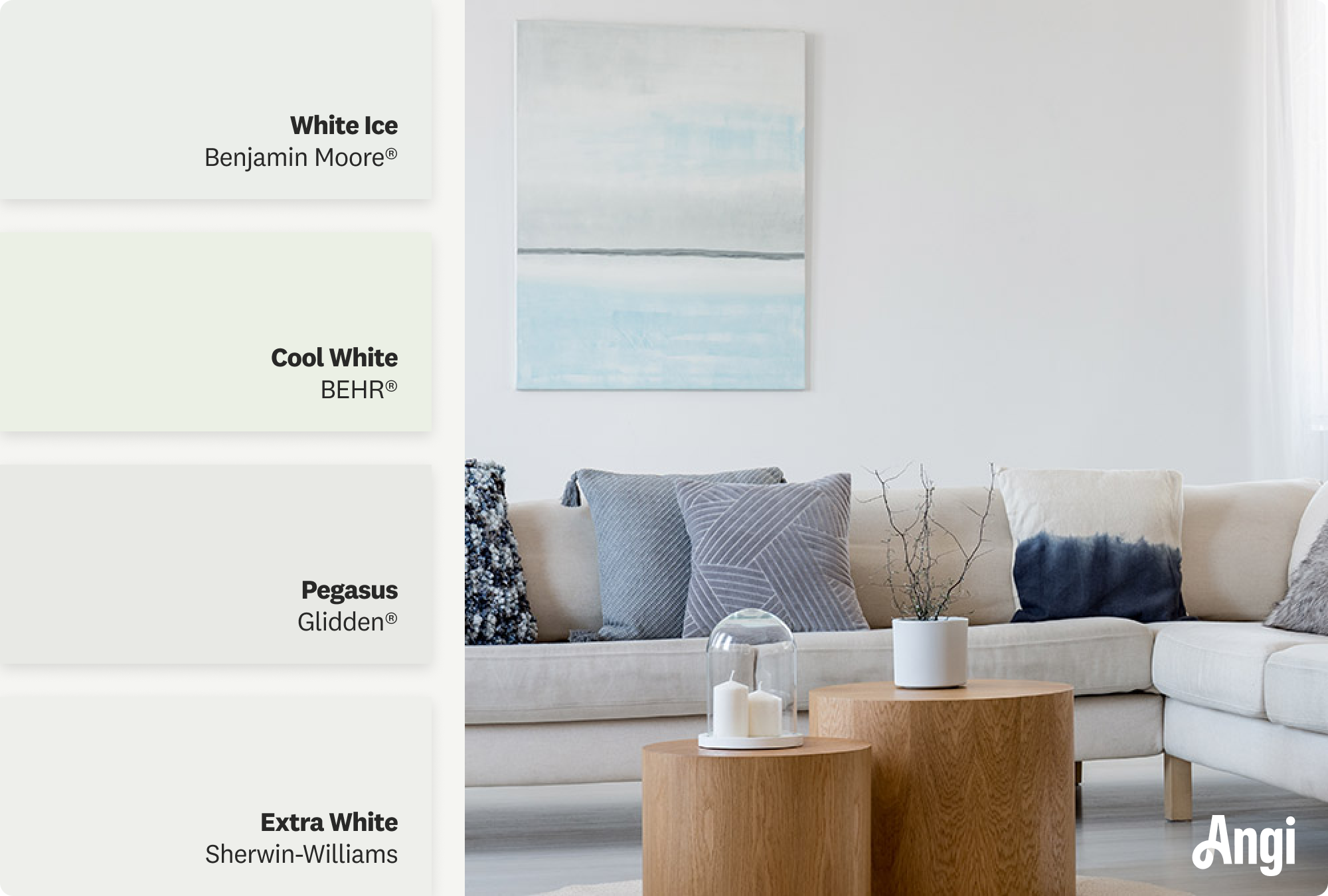 A sleek living room with cool white paint, featuring a large abstract blue-and-white painting