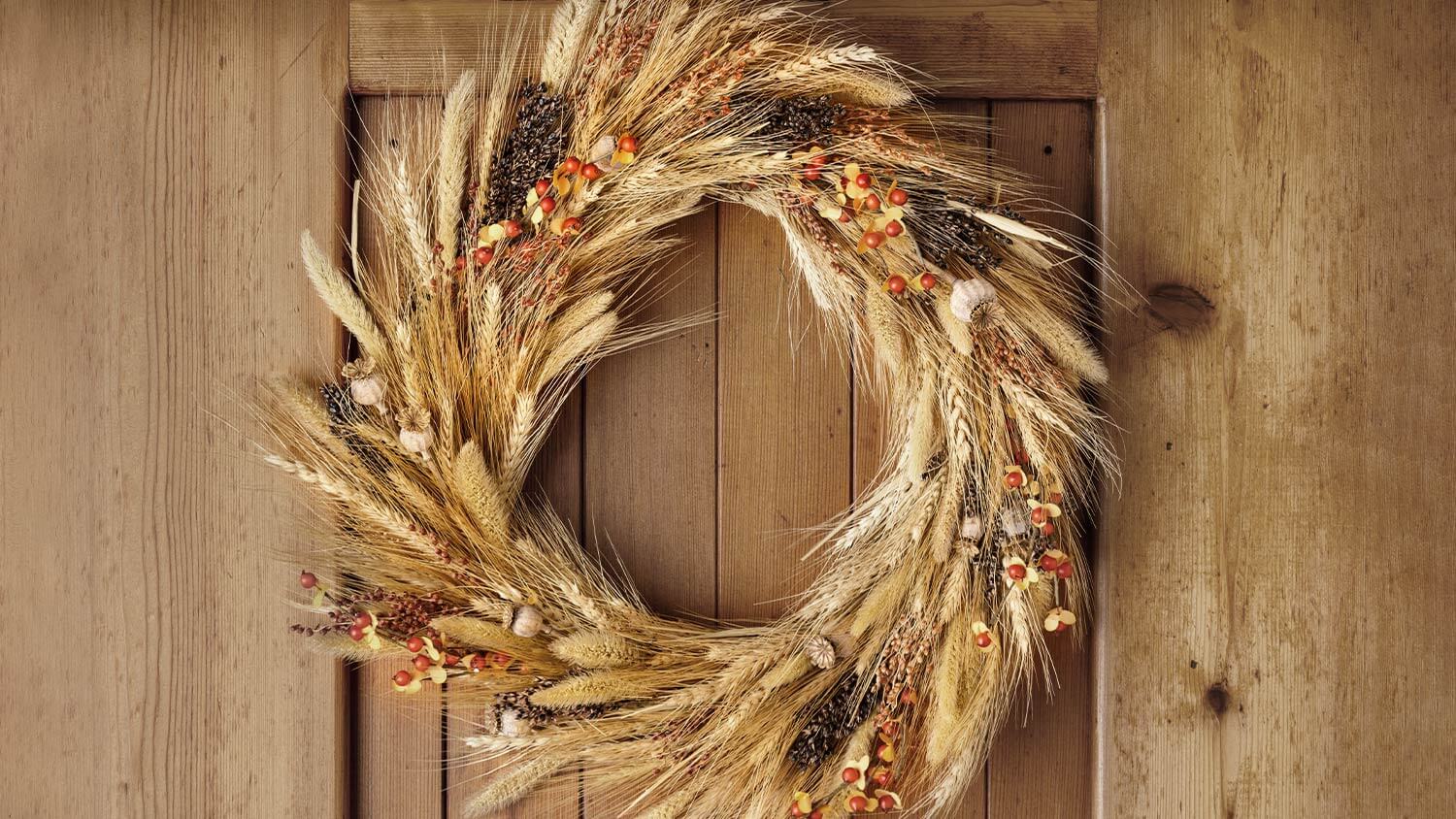 corn husk fall wreath on door