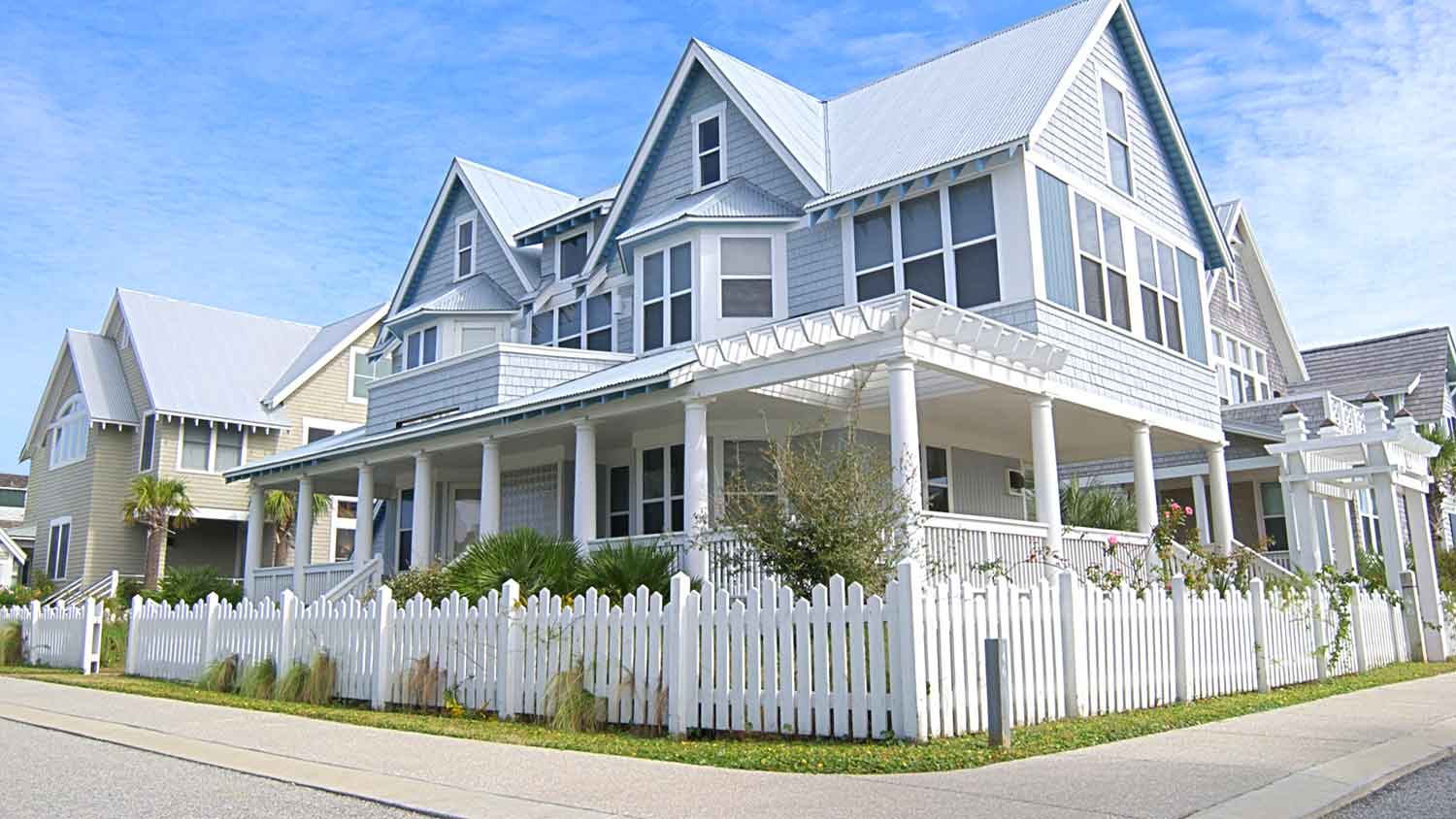 Corner house with white picket fence