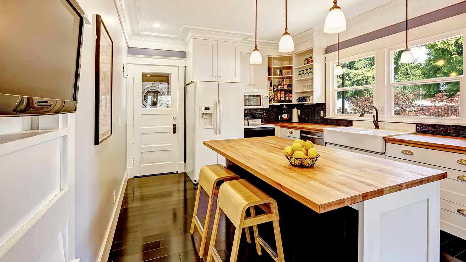 Butcher block countertops with stools underneath