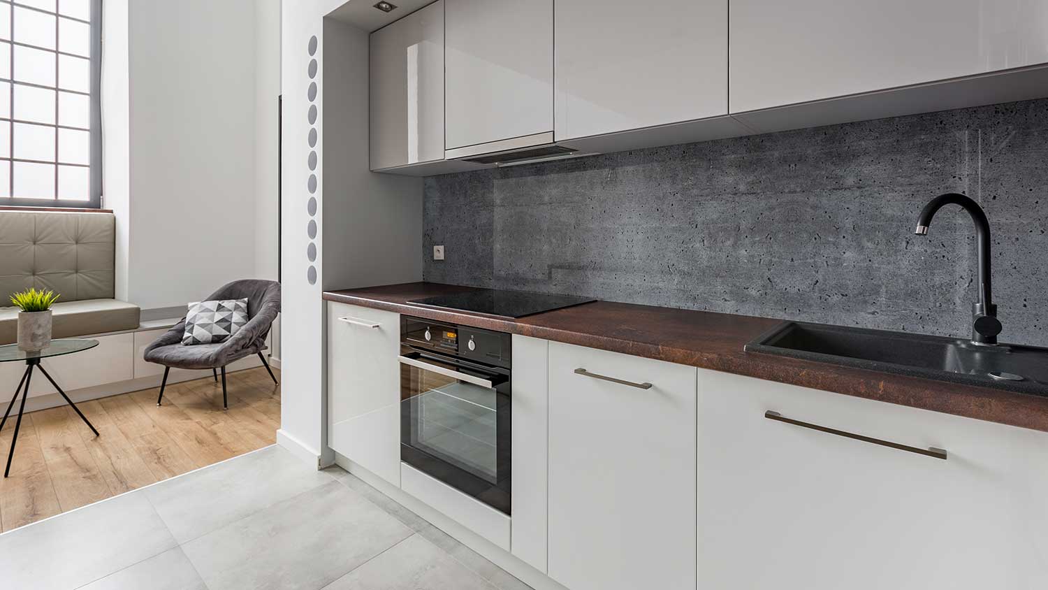 Concrete backsplash paired with wood countertops