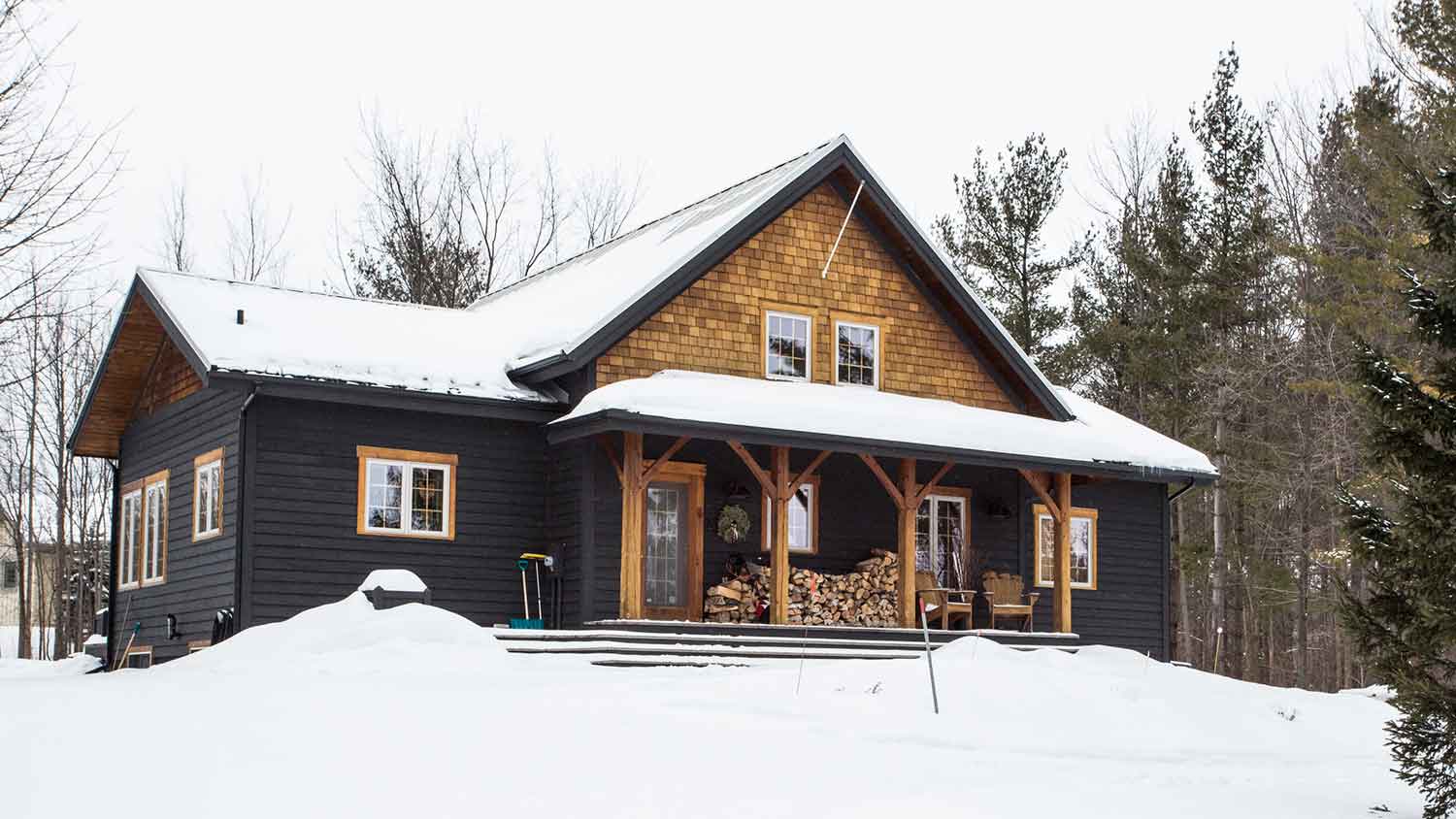 Steep slope roof house covered with snow