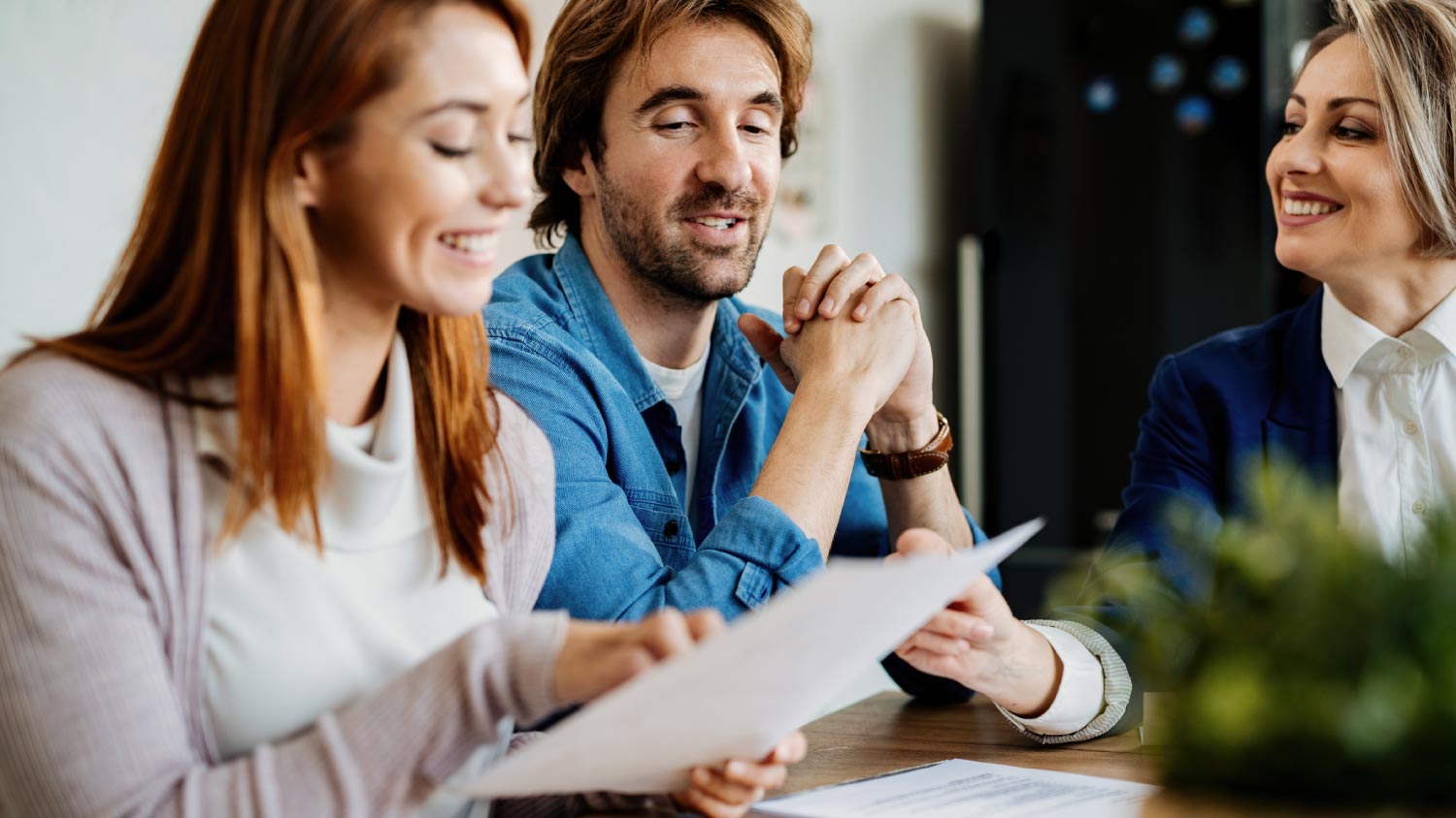 Couple analyzing financial reports