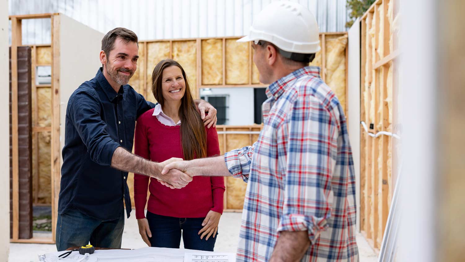 couple meeting with building contractor