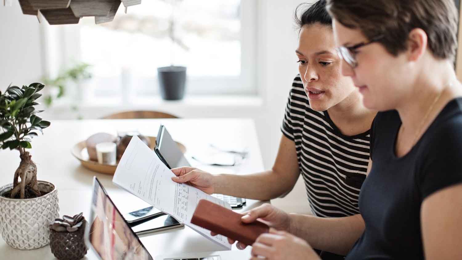 Couple at home reviewing house utility bills