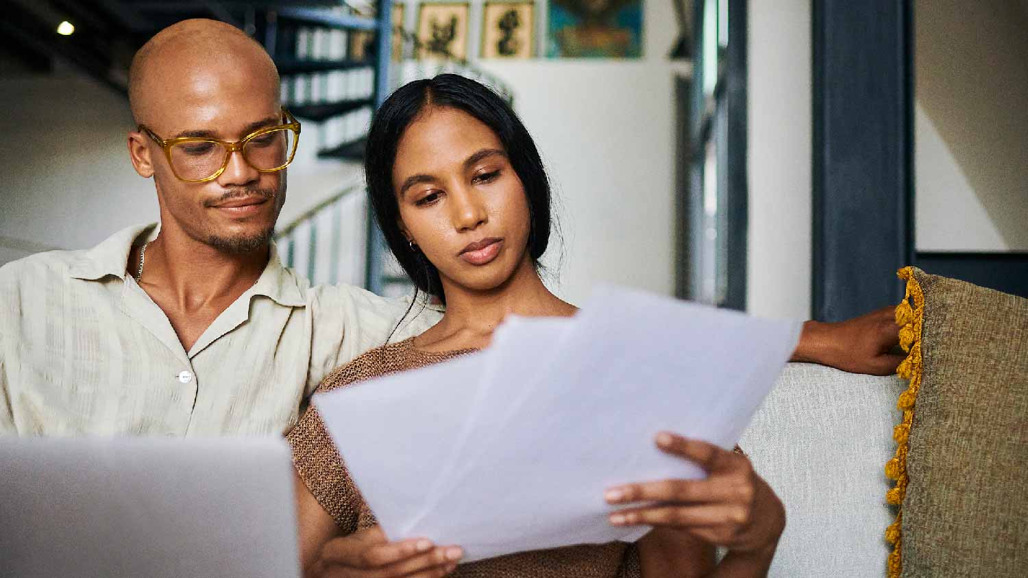 A couple reading their home inspection report