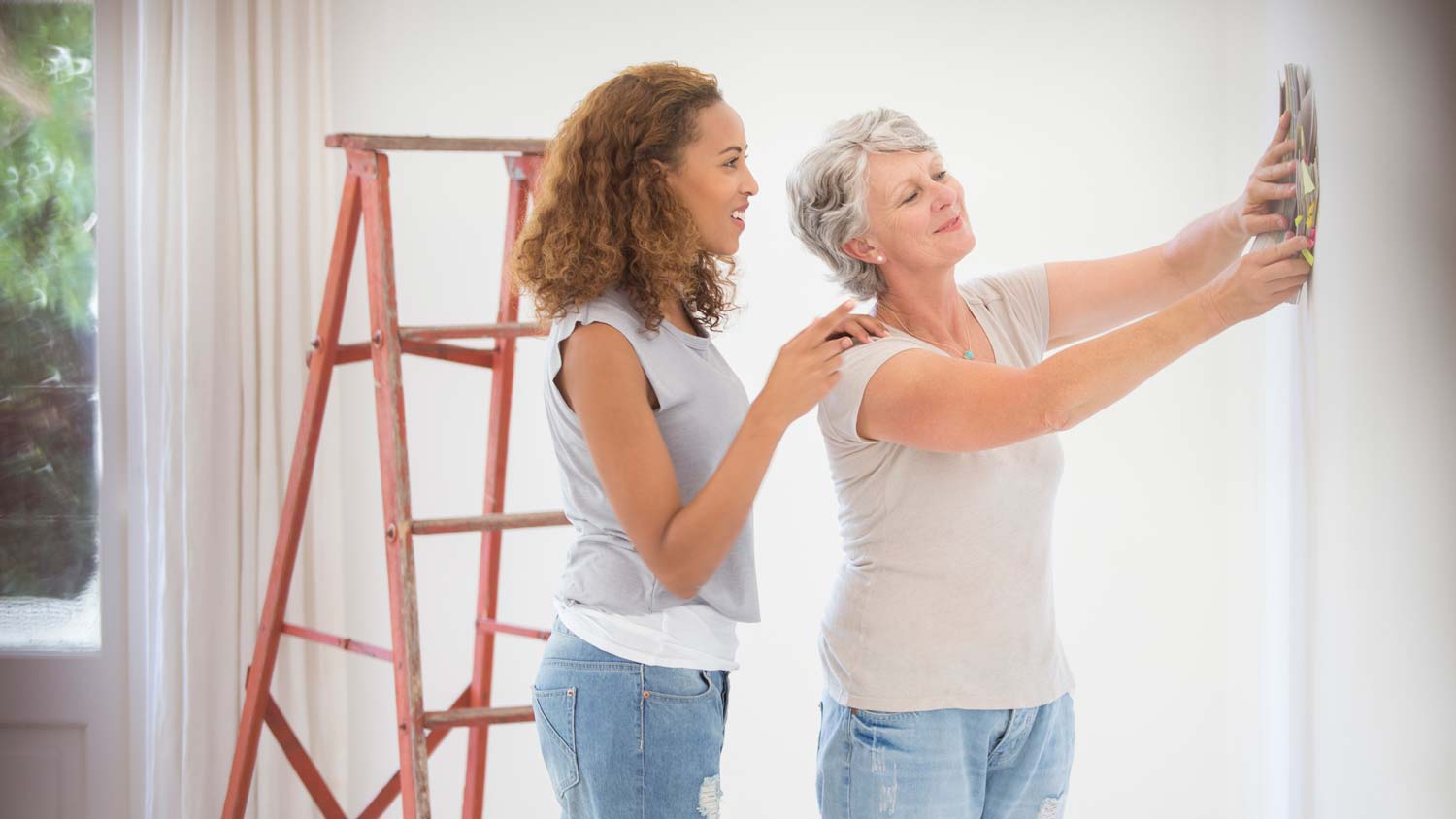 A couple selecting color to paint their room