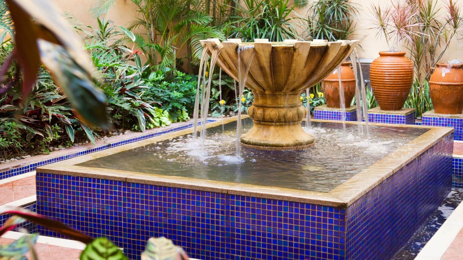 A courtyard fountain with blue tiles