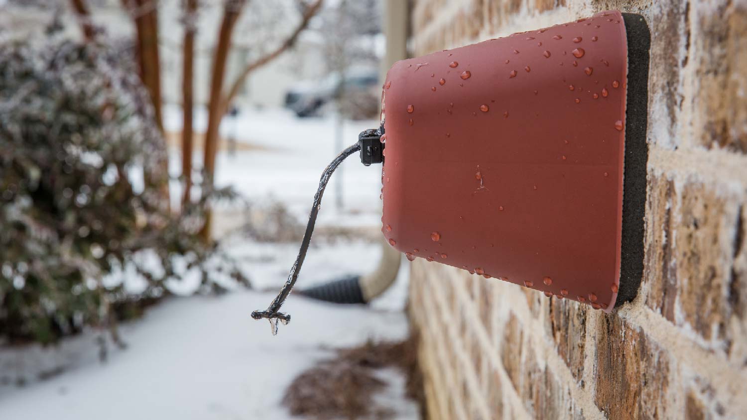 A covered outdoor faucet