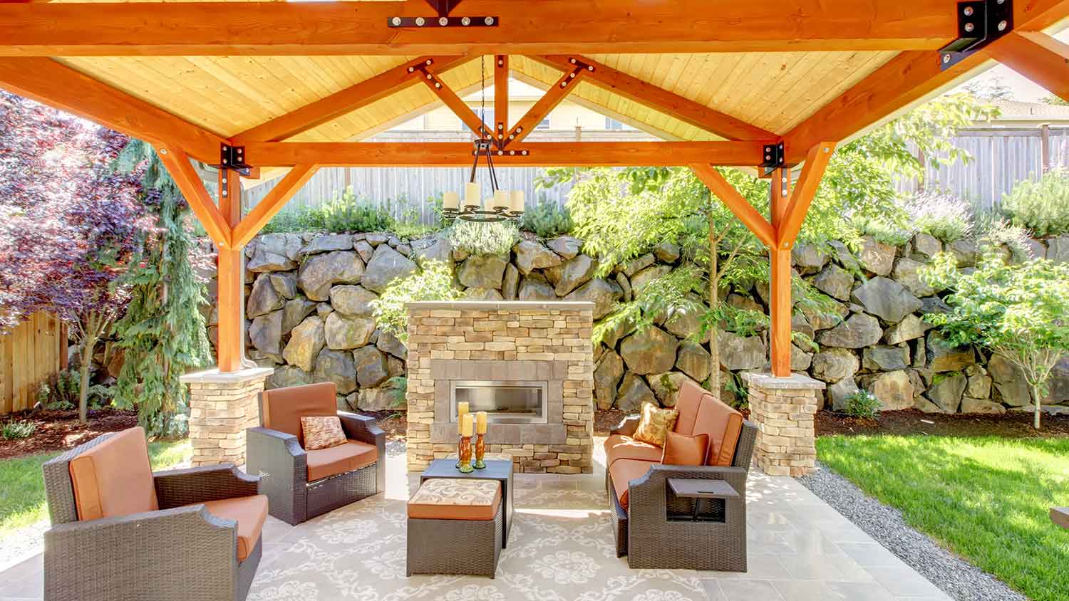 Patio with wooden pergola and fireplace 