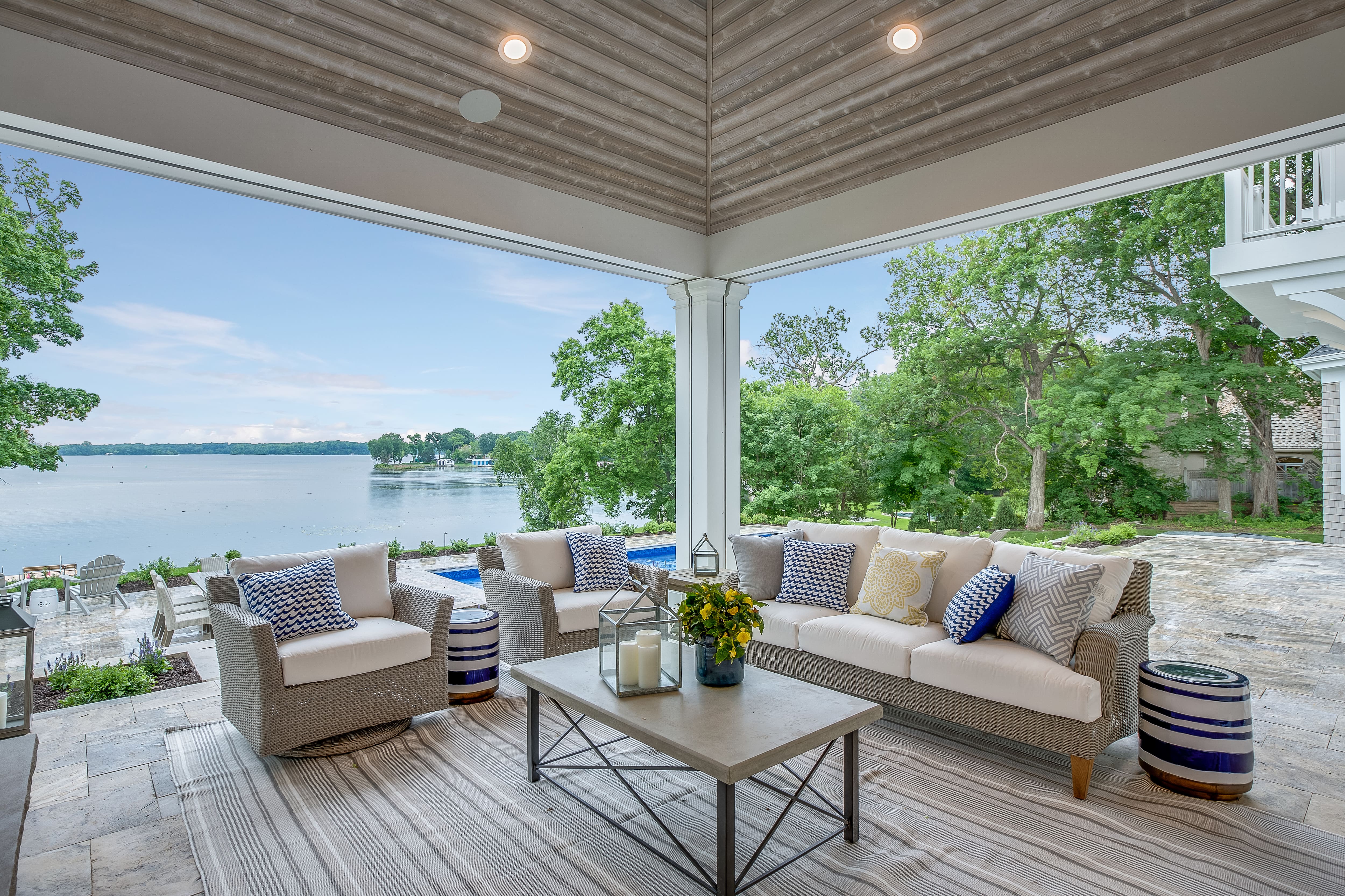 Lakeside covered porch area with outdoor furniture