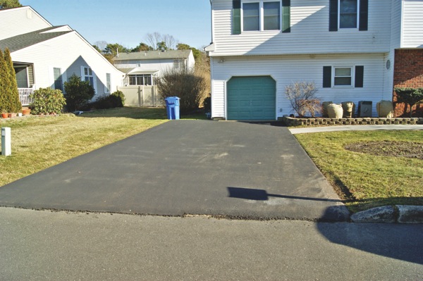 asphalt driveway installed by a scam artist contractor