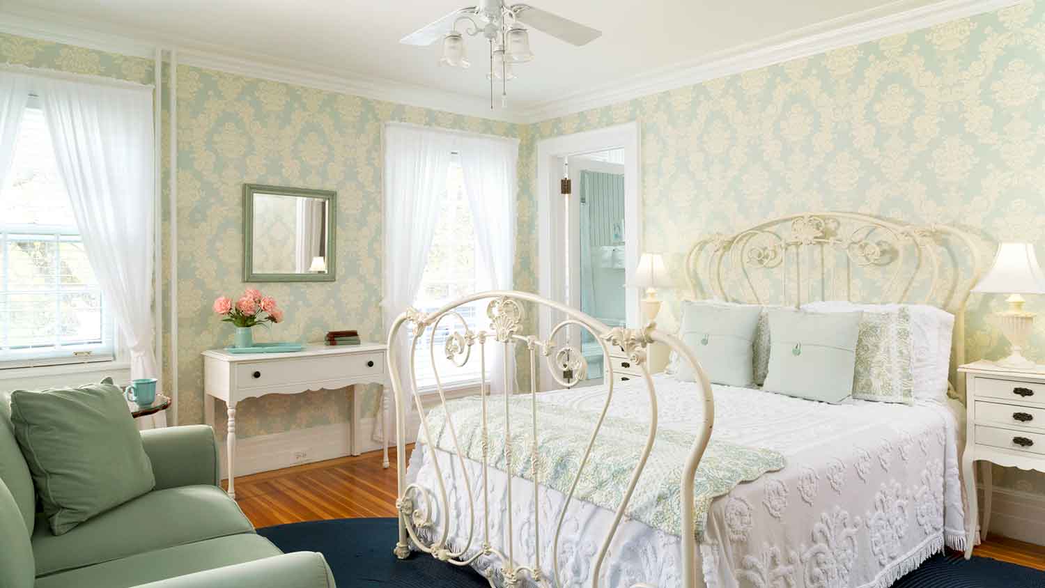 Blue floral wallpaper installed in a bedroom