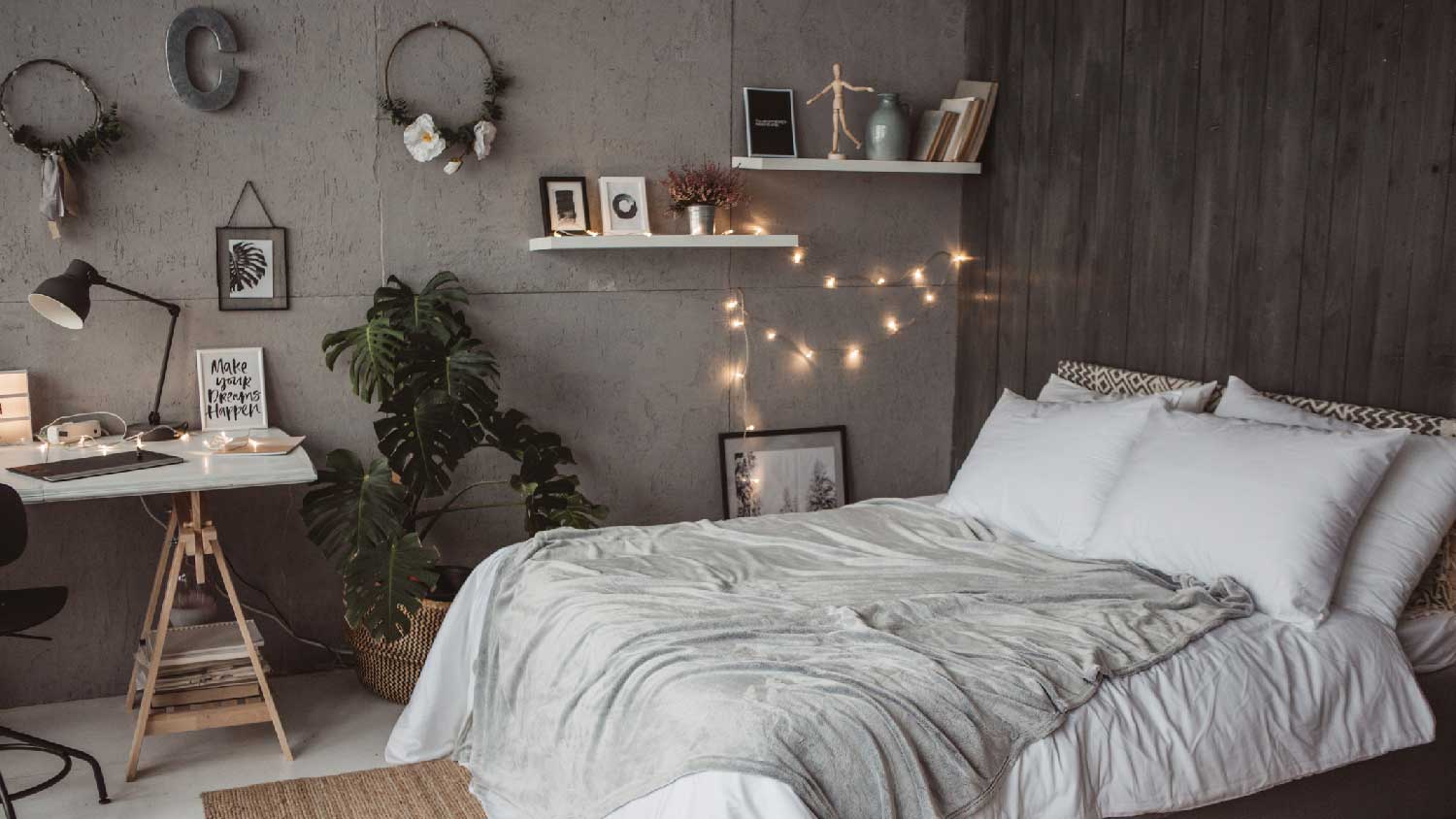 A cozy bedroom with string lights on the wall