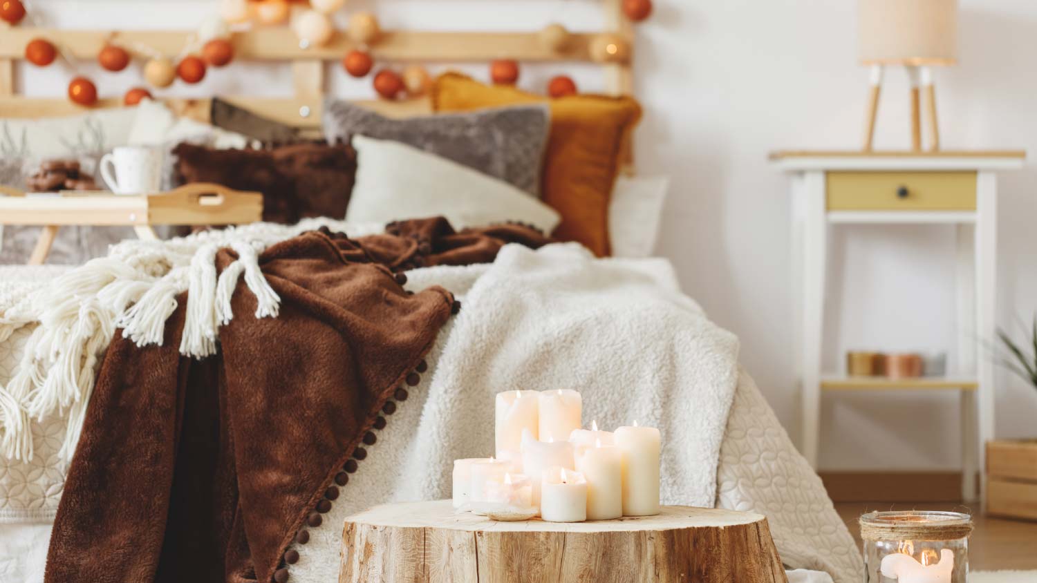 bedroom with side table with candles