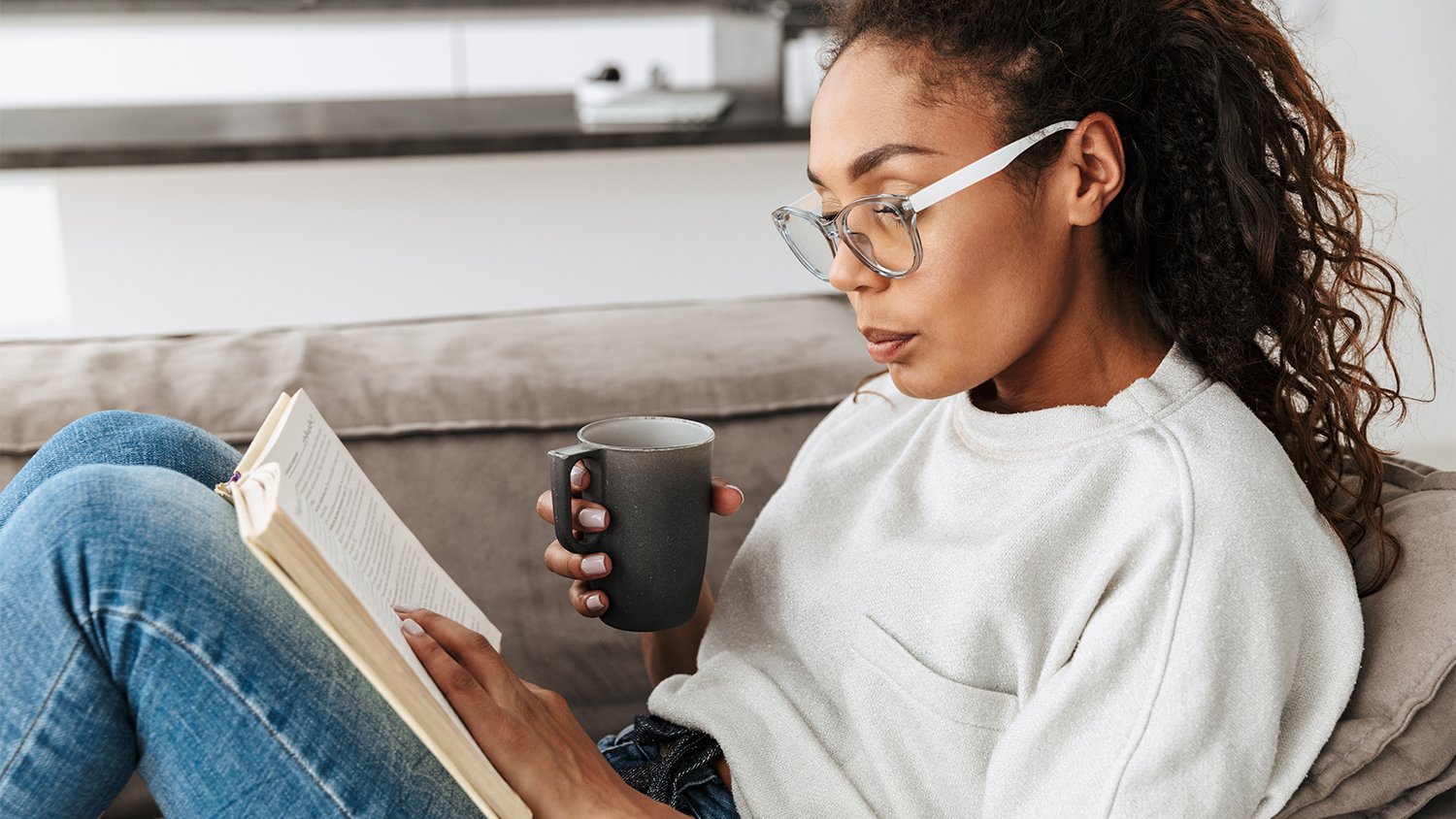 woman on the couch drinking tea
