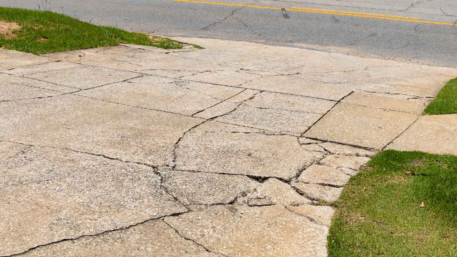 A cracked concrete driveway