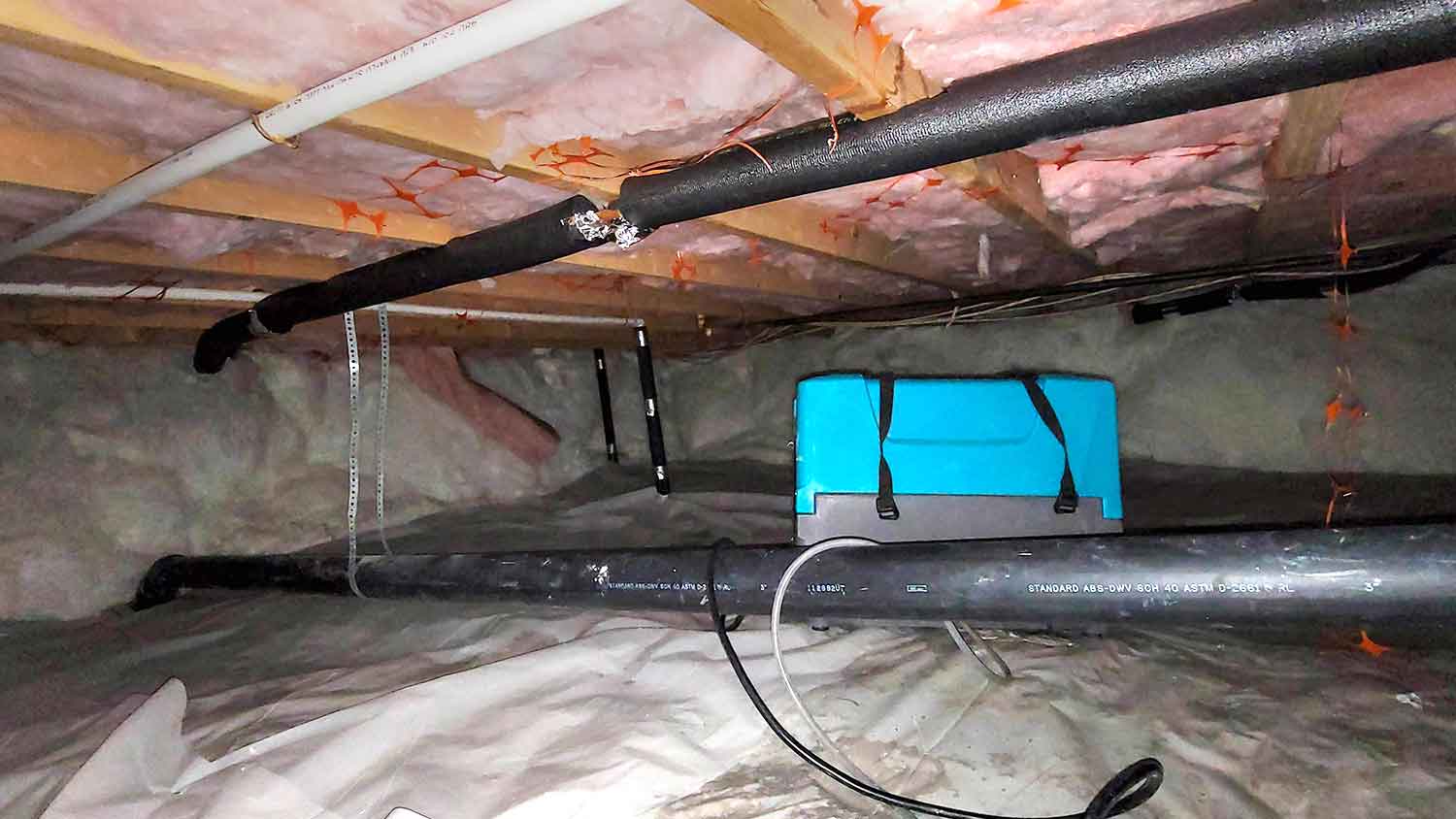 Dehumidifier installed in a crawl space
