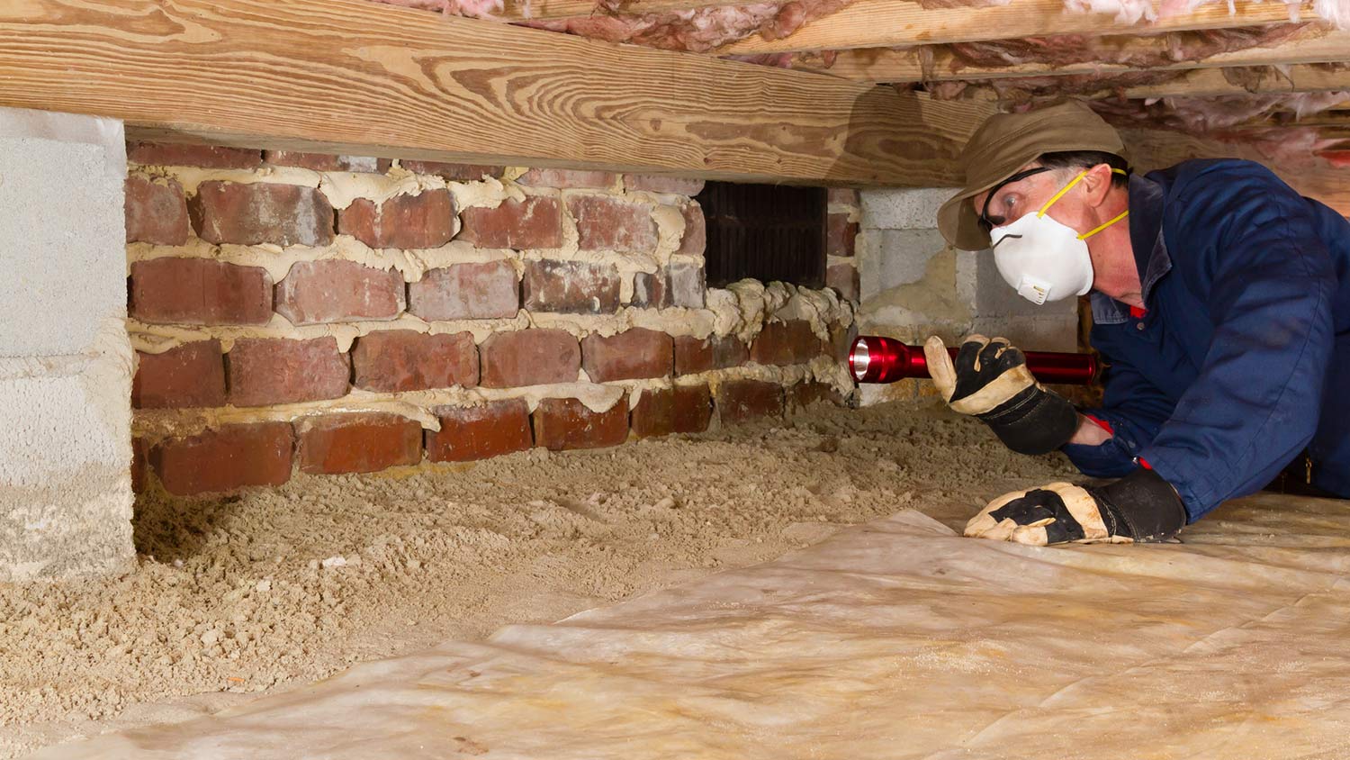 Person looking in crawlspace