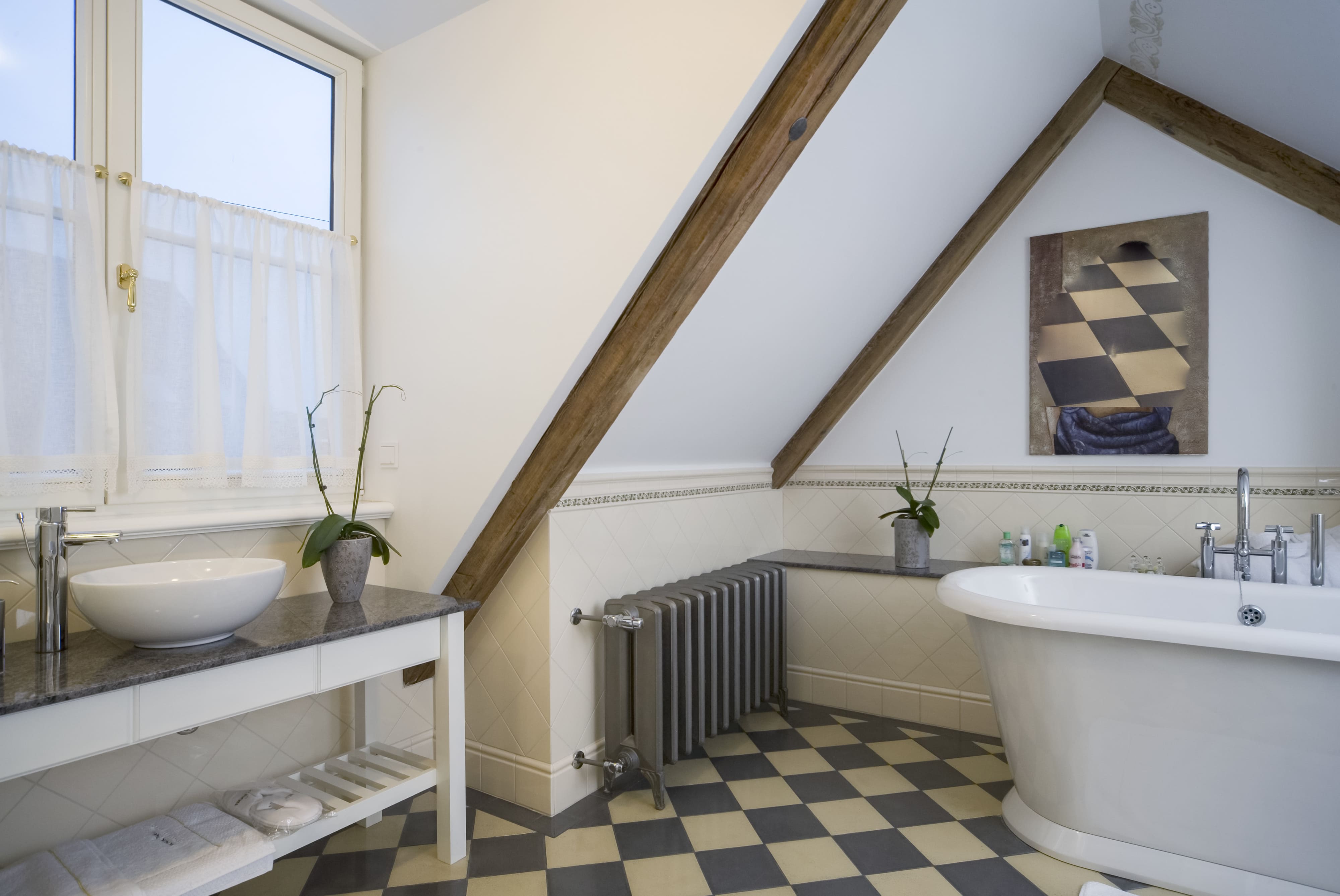 A small bathroom with reclaimed wood used as crown molding