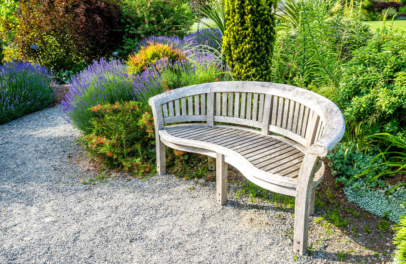 crushed stone walkway with bench