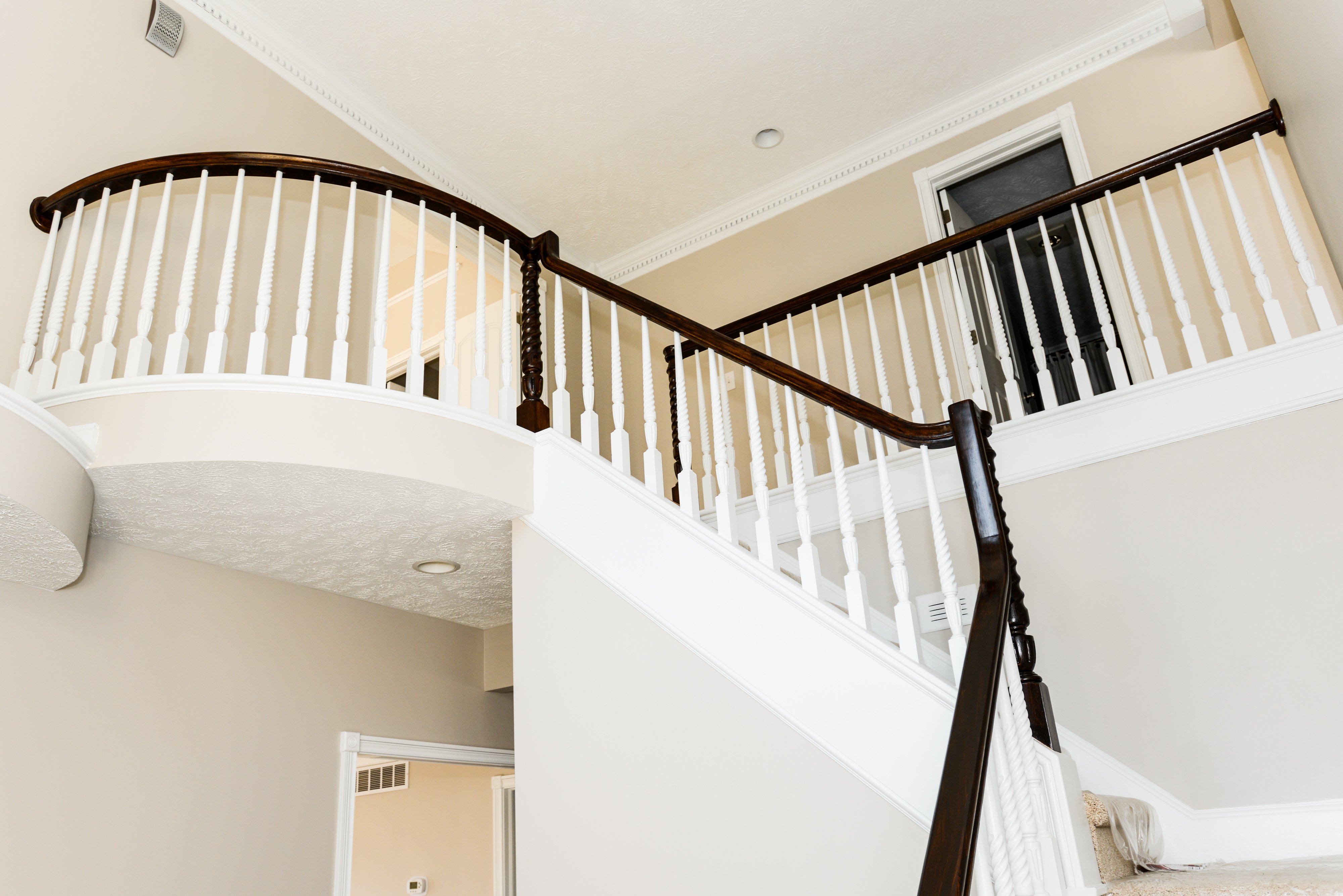 balcony black rail white stairs entry in foyer