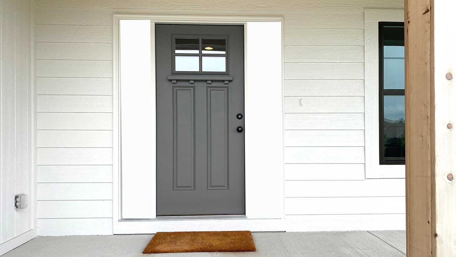House porch with dark gray front door