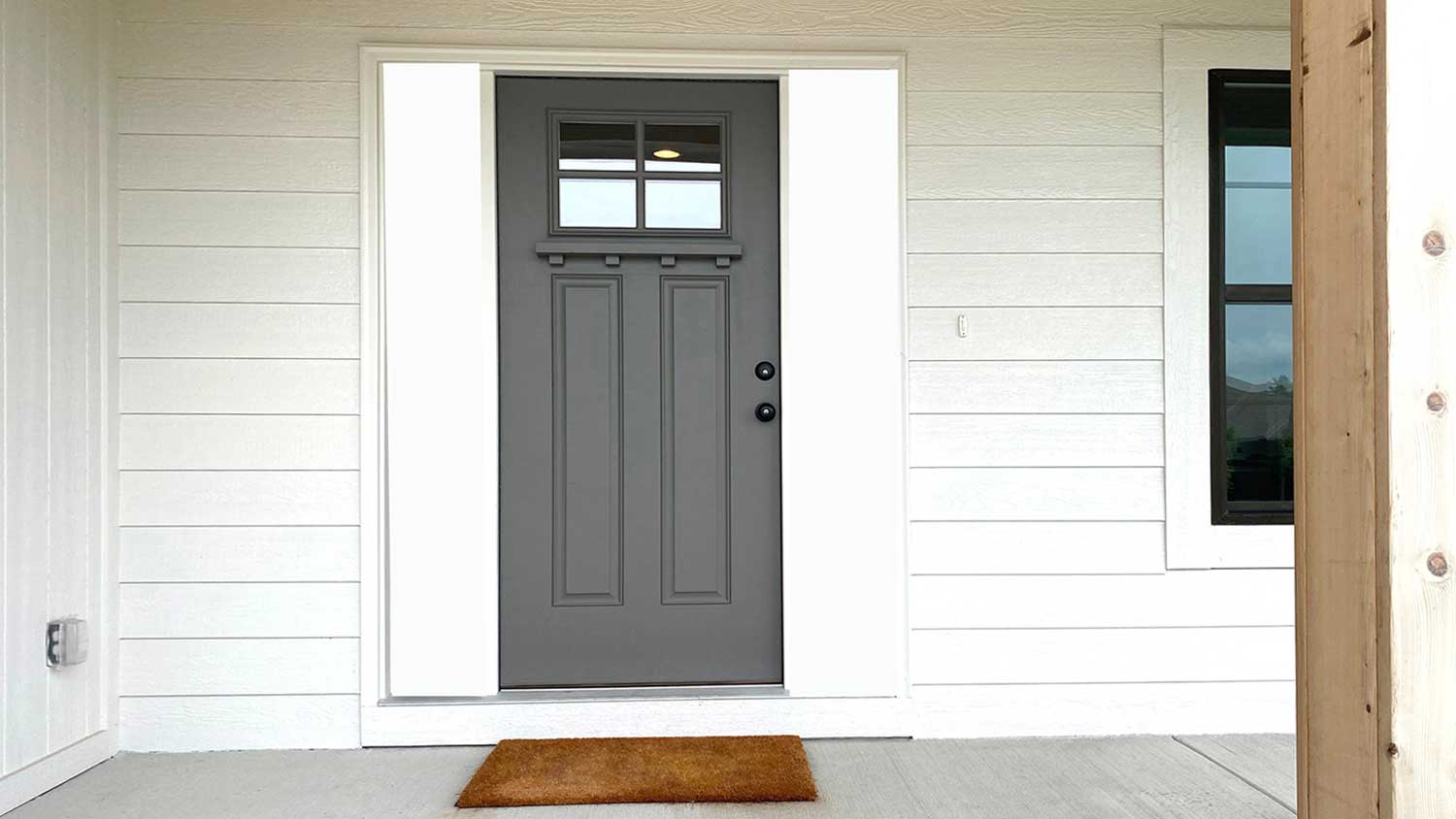 House porch with dark gray front door 