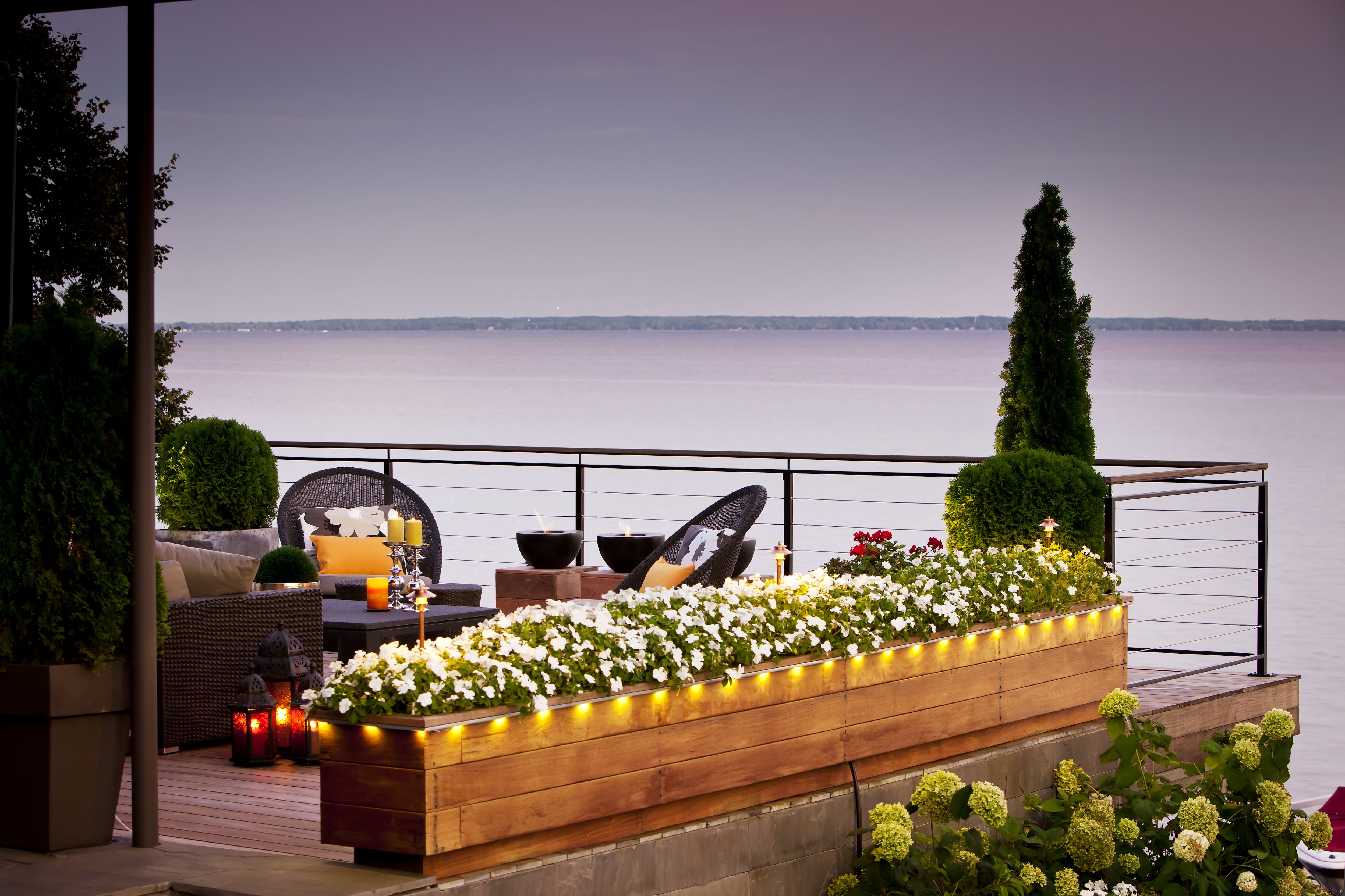 Deck planter box lined with rope string lights