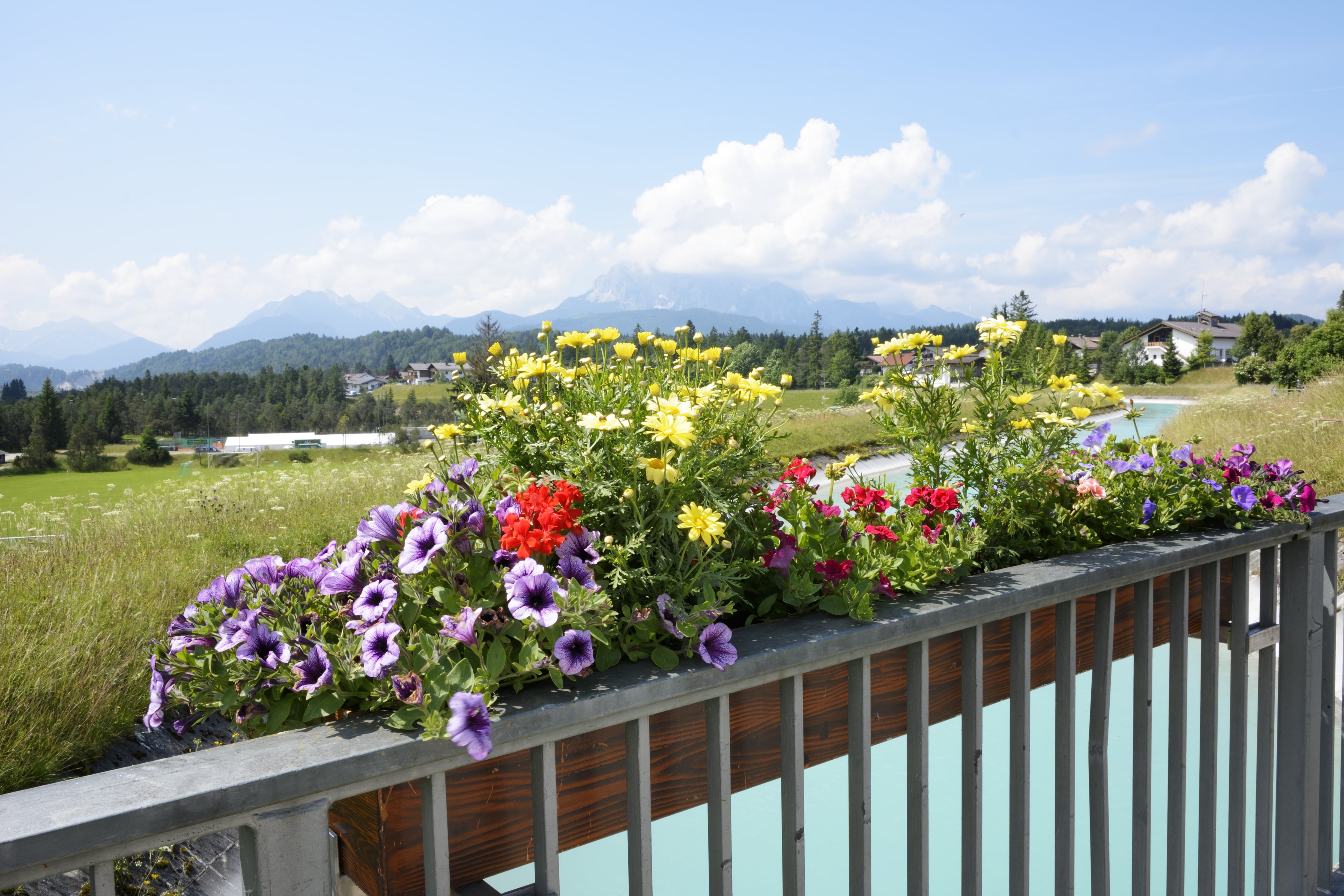 White porch railings with built-in planters 